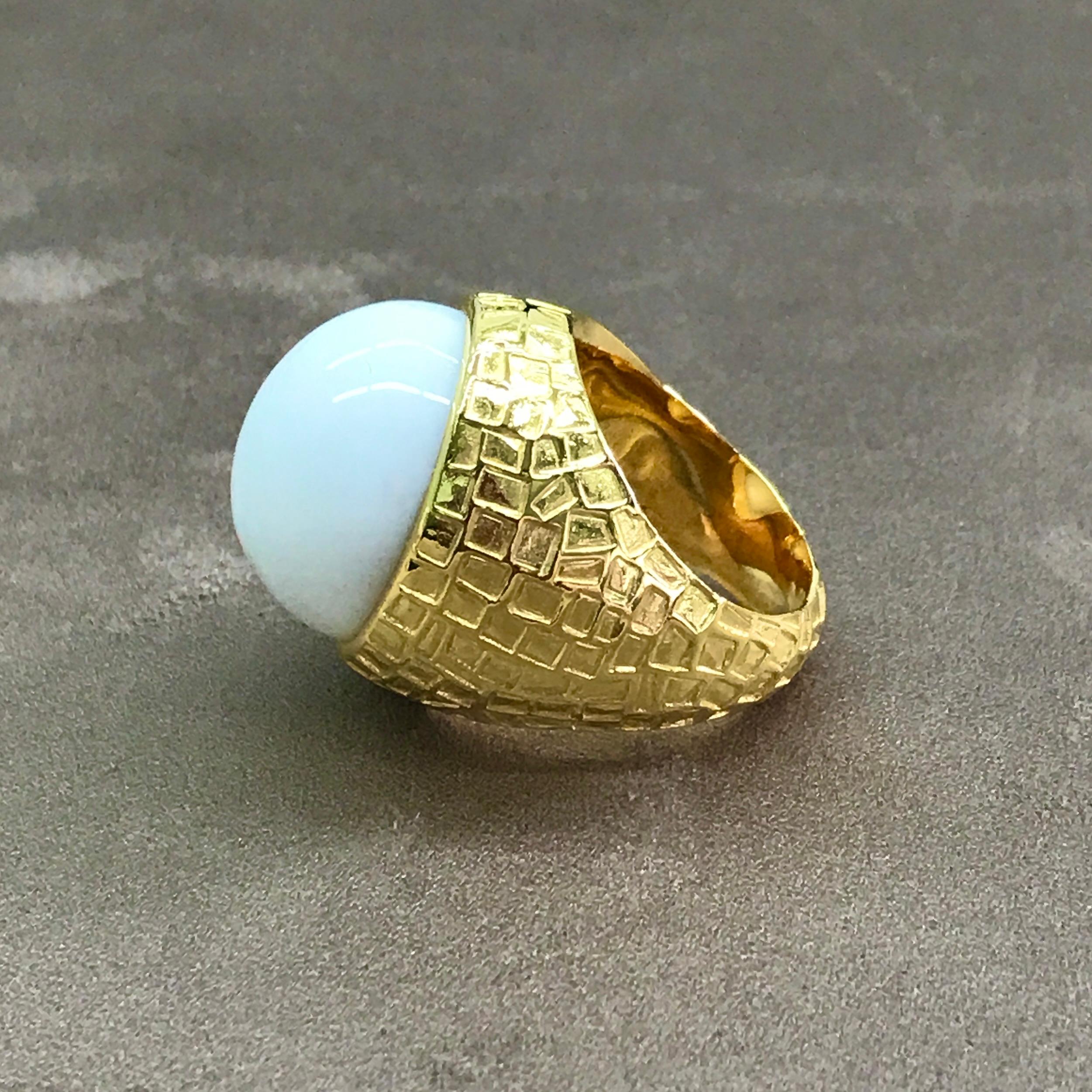 Set with a lustrous oval cabochon White Onyx within a 'chiselled' mount, this is a wonderfully simple yet striking ring - it would look great worn day or night and would not look out of place at any occasion. 

The stone measures 20mm x 18mm
The