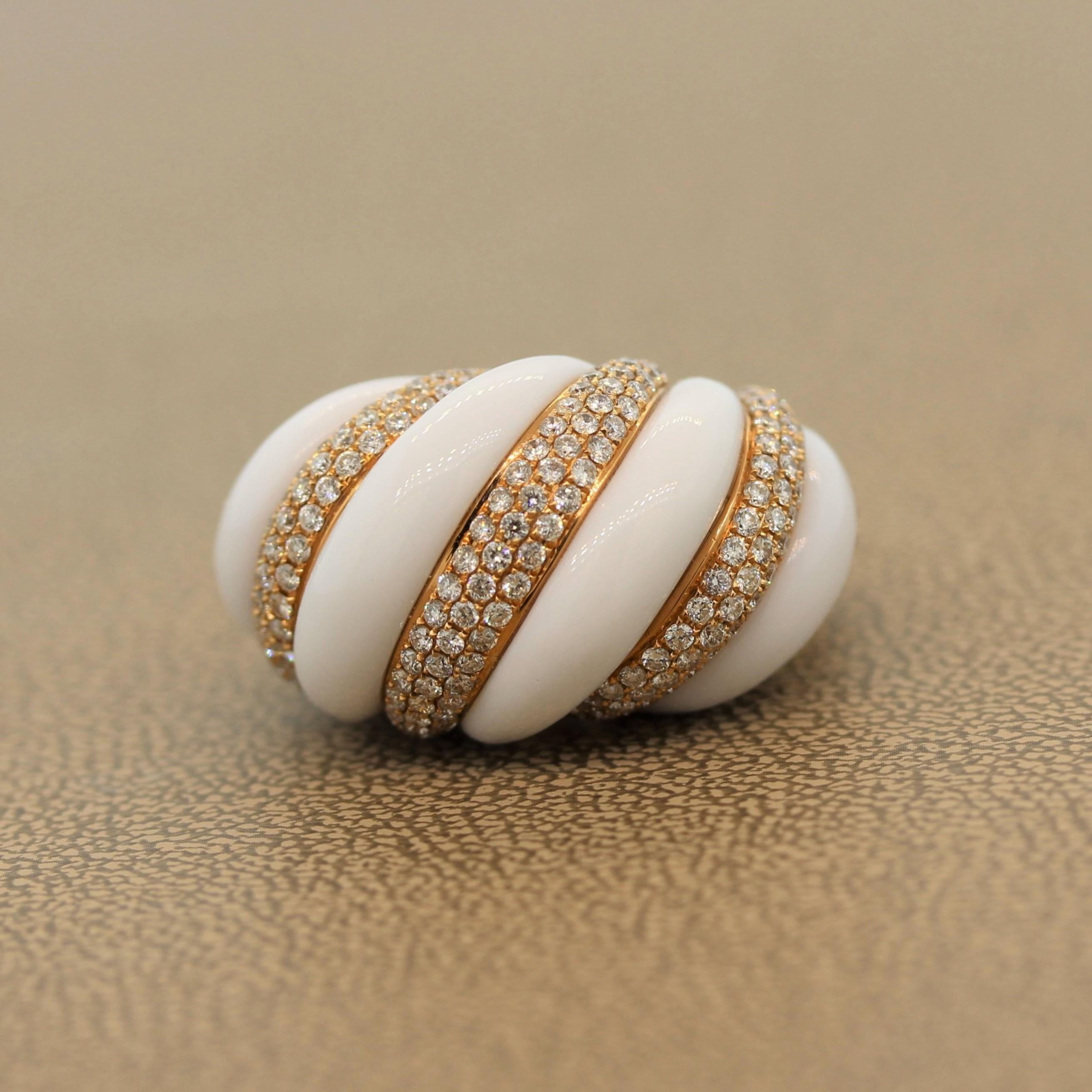 A unique cocktail ring featuring 20.65 carats of white onyx. The sharp colored white onyx swirls around 2.46 carats of VS quality diamonds which are set in an 18K rose gold setting. There is great contrast and movement between the white onyx and the