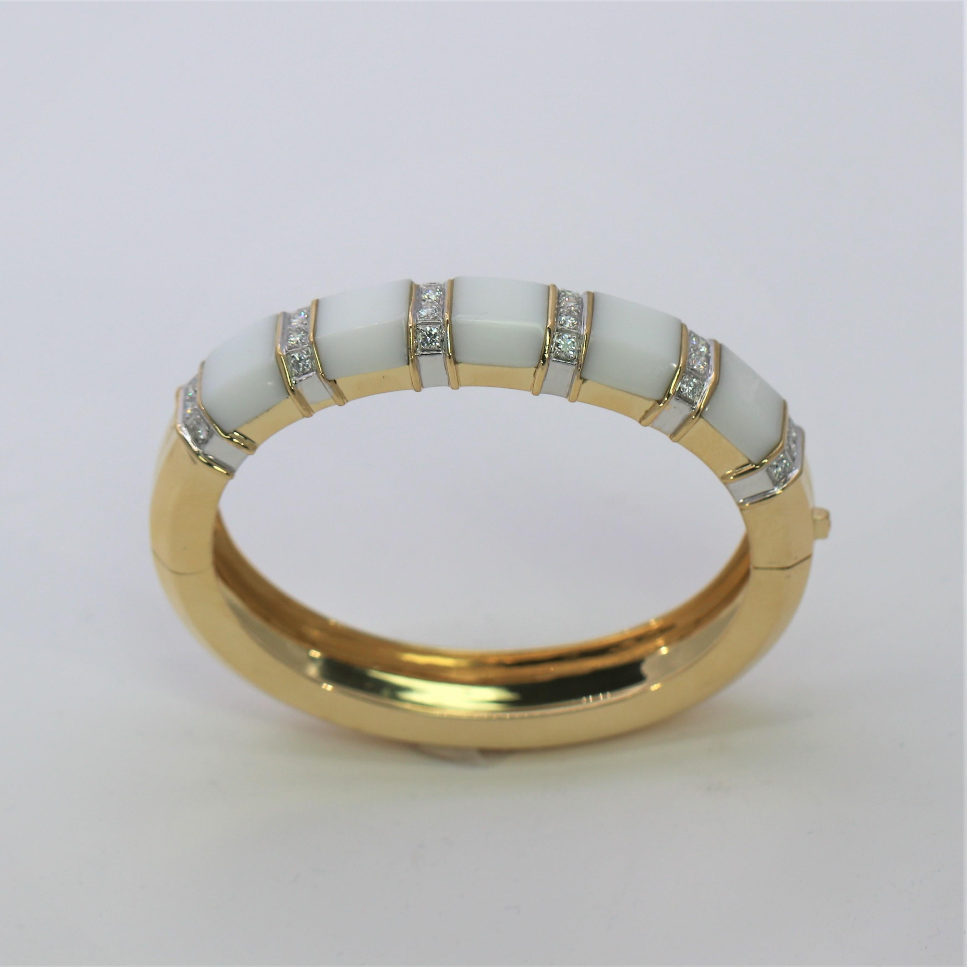 A great every day bangle for any woman who wants an outstanding casual bracelet. It is smart, tailored and elegant, all at the same time. Made of 18K Yellow Gold and set with 24 round brilliant cut diamonds weighing an approximate total of 1.25Ct of