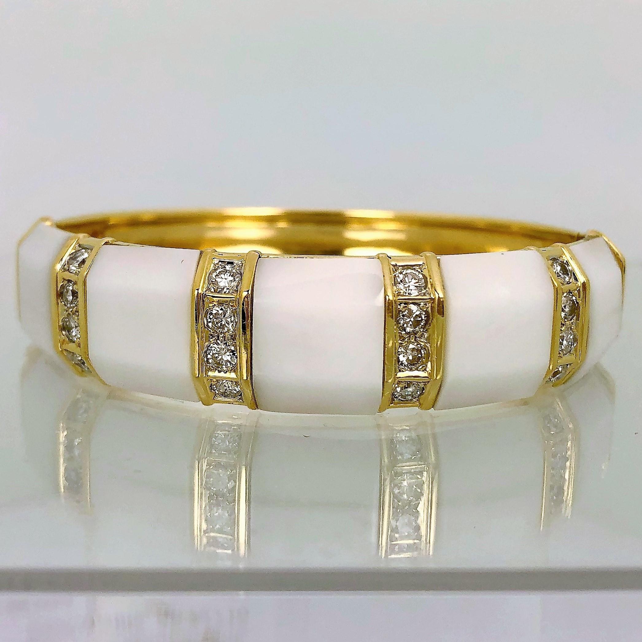 Made of 18K Yellow Gold inset with five custom cut white onyx sections flanked 
by six rows of channel set round brilliant cut diamonds. Each row contains 4 diamonds. The 24 diamonds weigh an approximate total of 1.25CT of overall G Color VS2-SI1