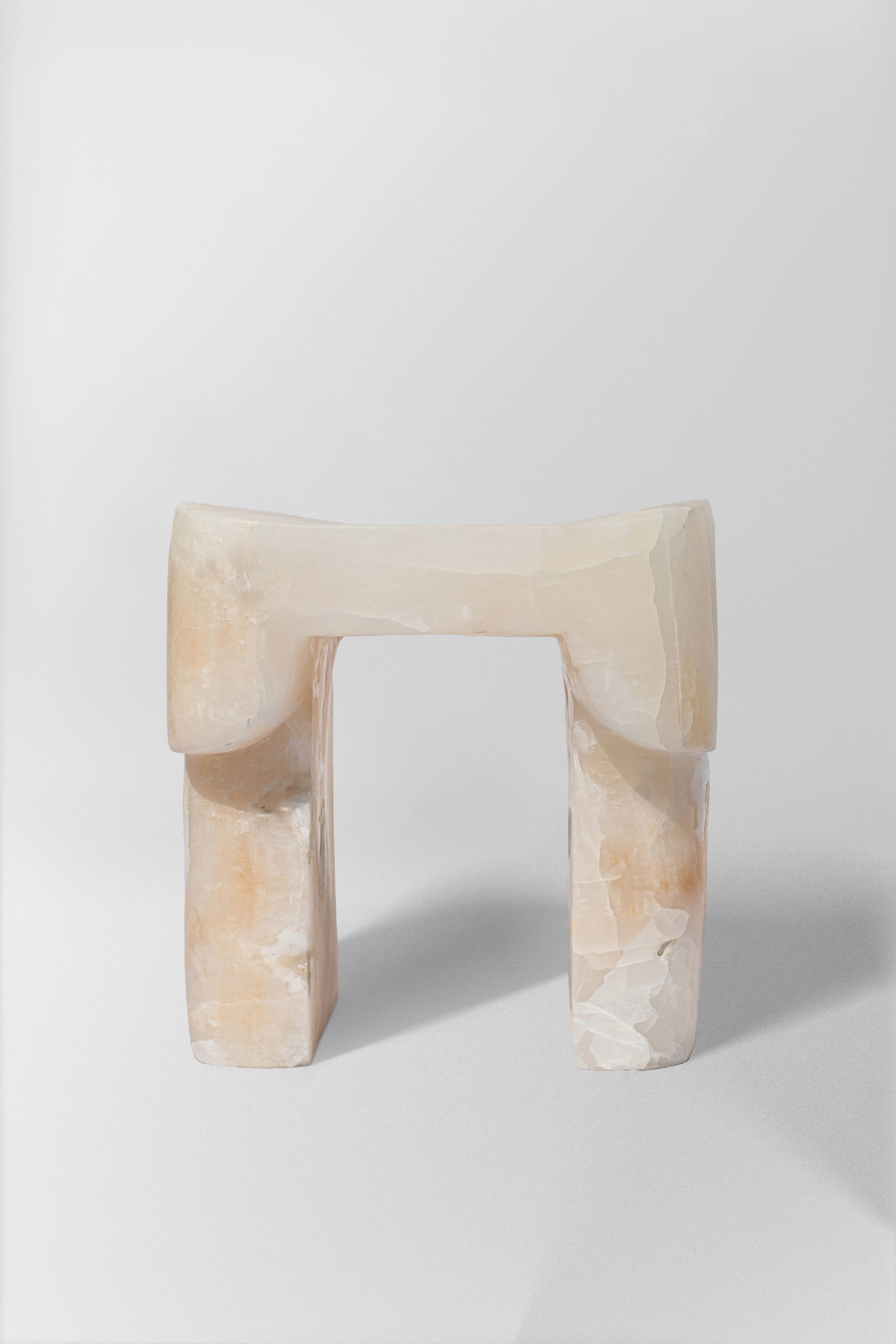 White Onyx Stool by Henry Wilson
Limited Edition Of 8 Pieces
Dimensions: D 67,5 x W 61,5 x H 62,5 cm.
Materials: White onyx.

Henry Wilson's work combines a rational, democratic utility with an element of sculptural expression. There is a clear form