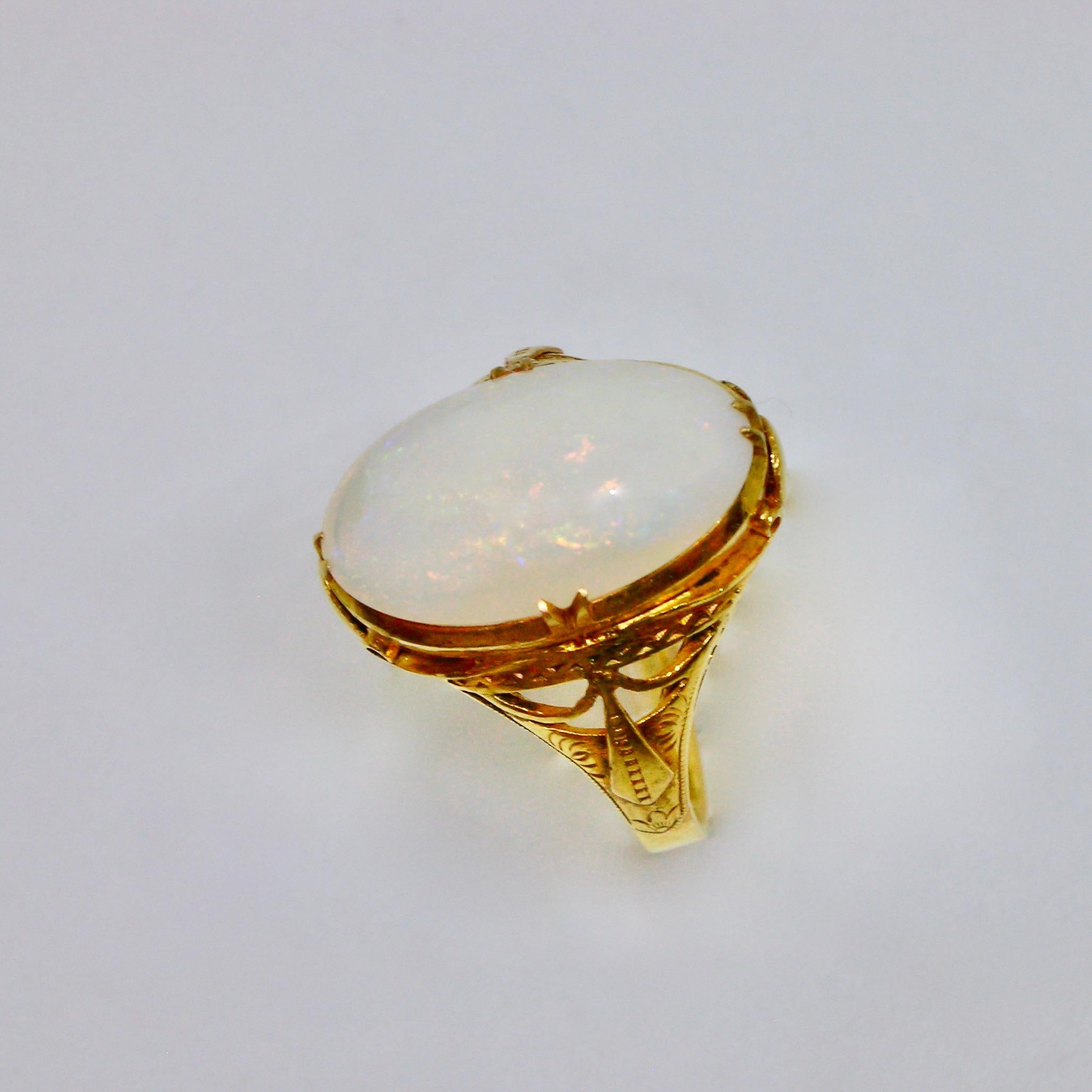 If you like simplicity, this exquisite Art Nouveau ring might be for you. The attention to detail and quality of craftmanship reminds us of jewelry that is no longer found. Opals are known for their iridescence and this is clearly seen in this stone