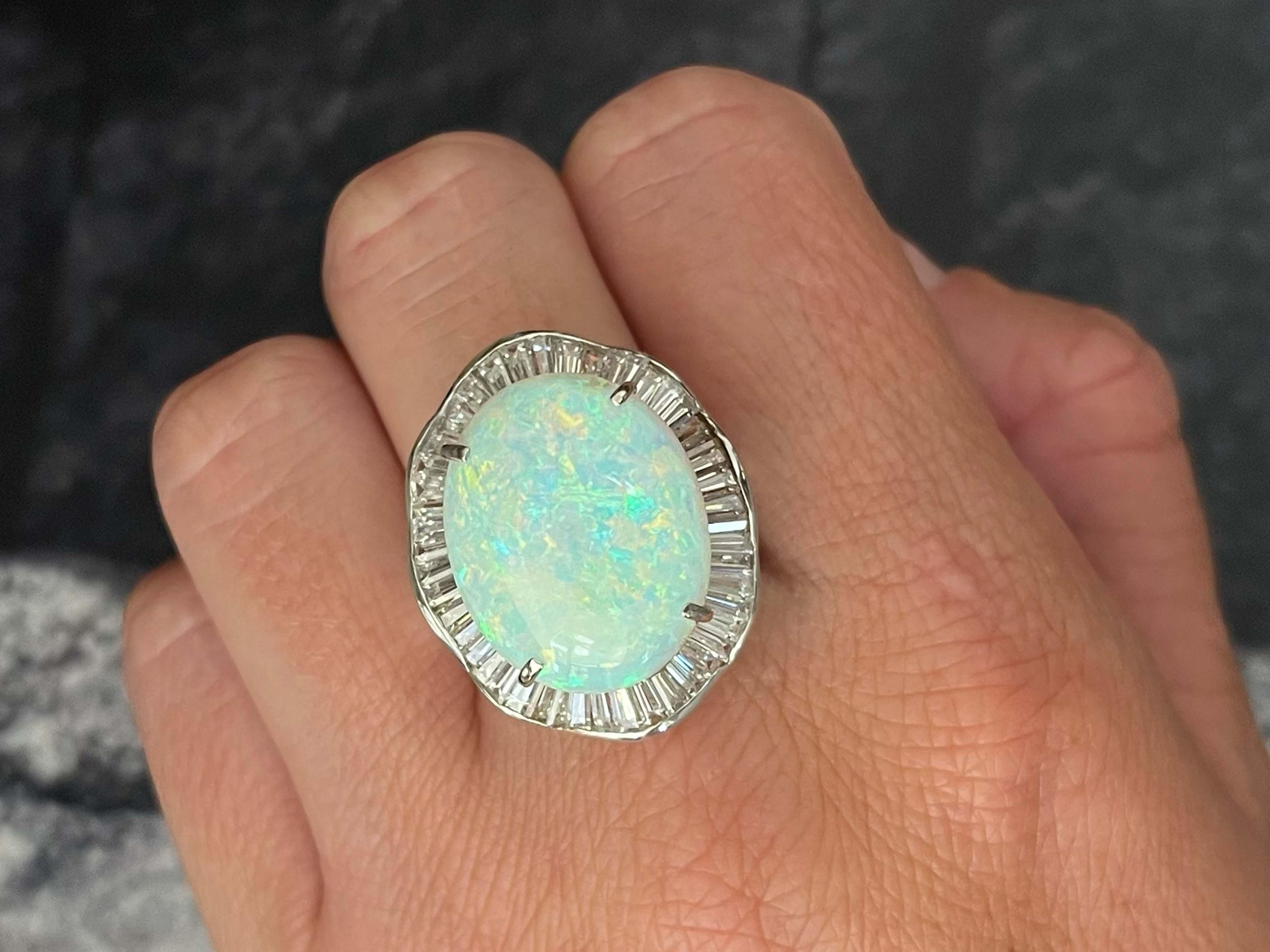 Item Specifications:

Metal: 14K White Gold 

Style: Opal and Diamond Ring

Total Weight: 11.3 Grams

Gemstone Specifications:

Center Gemstone: White Opal

Gemstone Measurements: 20.12 mm x 16.15 mm x 5.29 mm

Gemstone Carat Weight: ~9.75