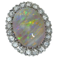 White Opal Cabochon and Diamond Halo Ring