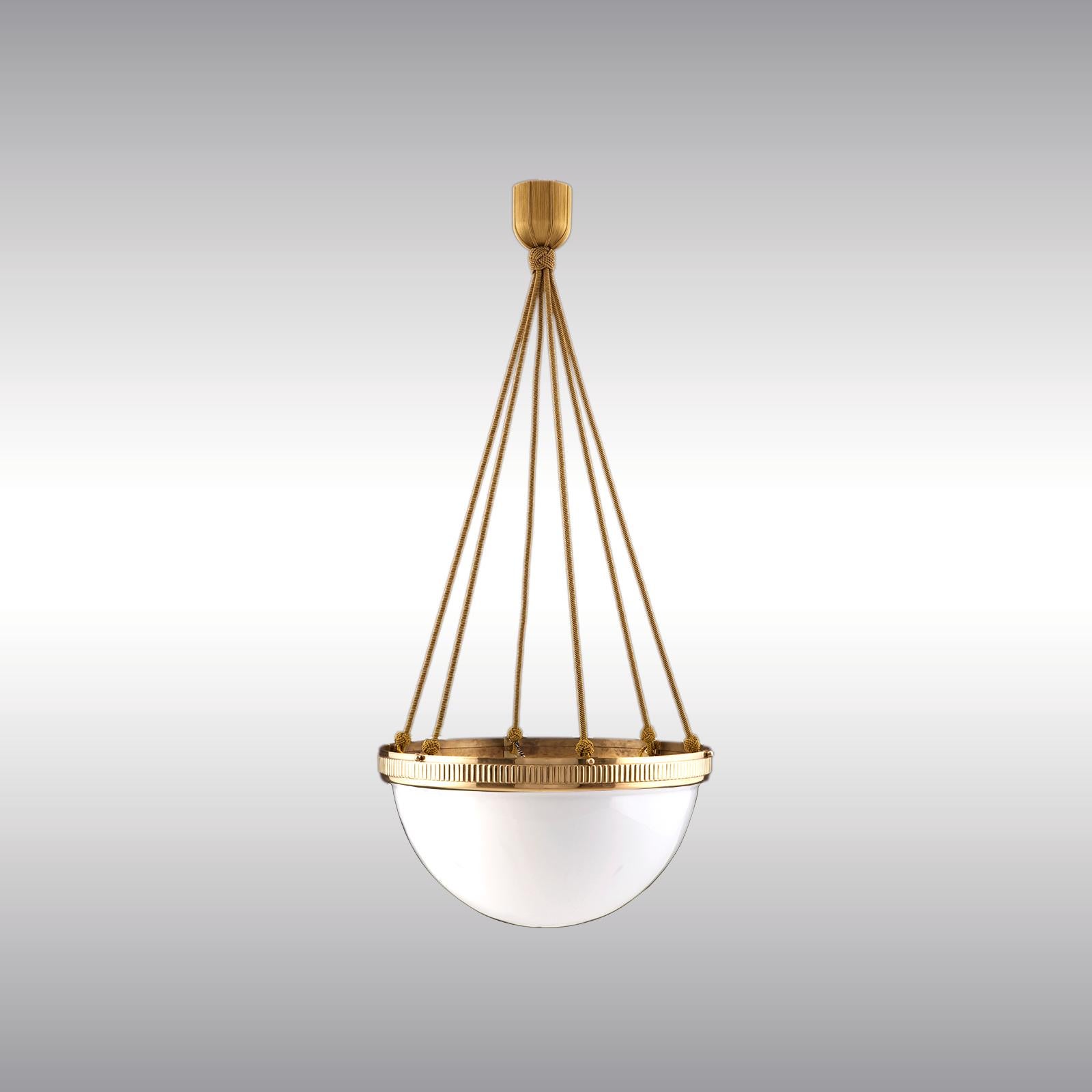 

Chandelier with a white opaline-glass in a handcrafted brass-rim, hanging on works of passamentery

Brass rim in several finishes, handblown opaline-glass and handcrafted passamentery
4400
USA and CAN:
All electrical components according to the UL