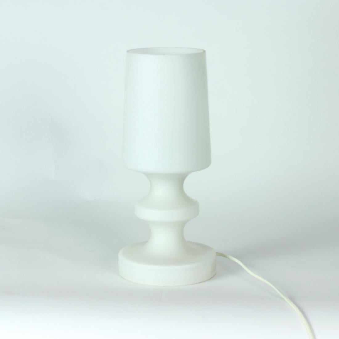 Iconic table lamp produced in mid-century design era of Czechoslovakia. Produced by OPP Jihlava, design by Stefan Tabery. Tabery produced a line of glass lamps in shapes of chess pieces. This one is an original piece, produced out of a opaline