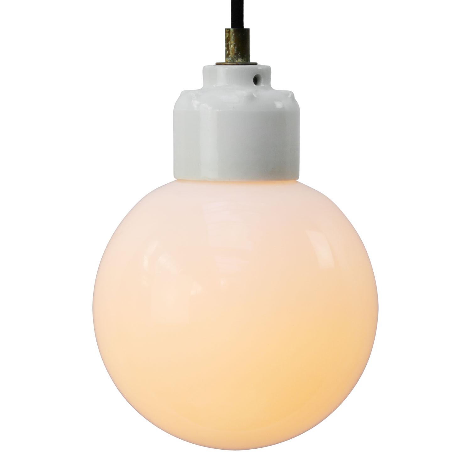 Opaline glass pendant.
2 meter black wire
Porcelain top with brass strain relief

Weight: 0.80 kg / 1.8 lb

E14 bulb holder. Priced per individual item. All lamps have been made suitable by international standards for incandescent light bulbs,