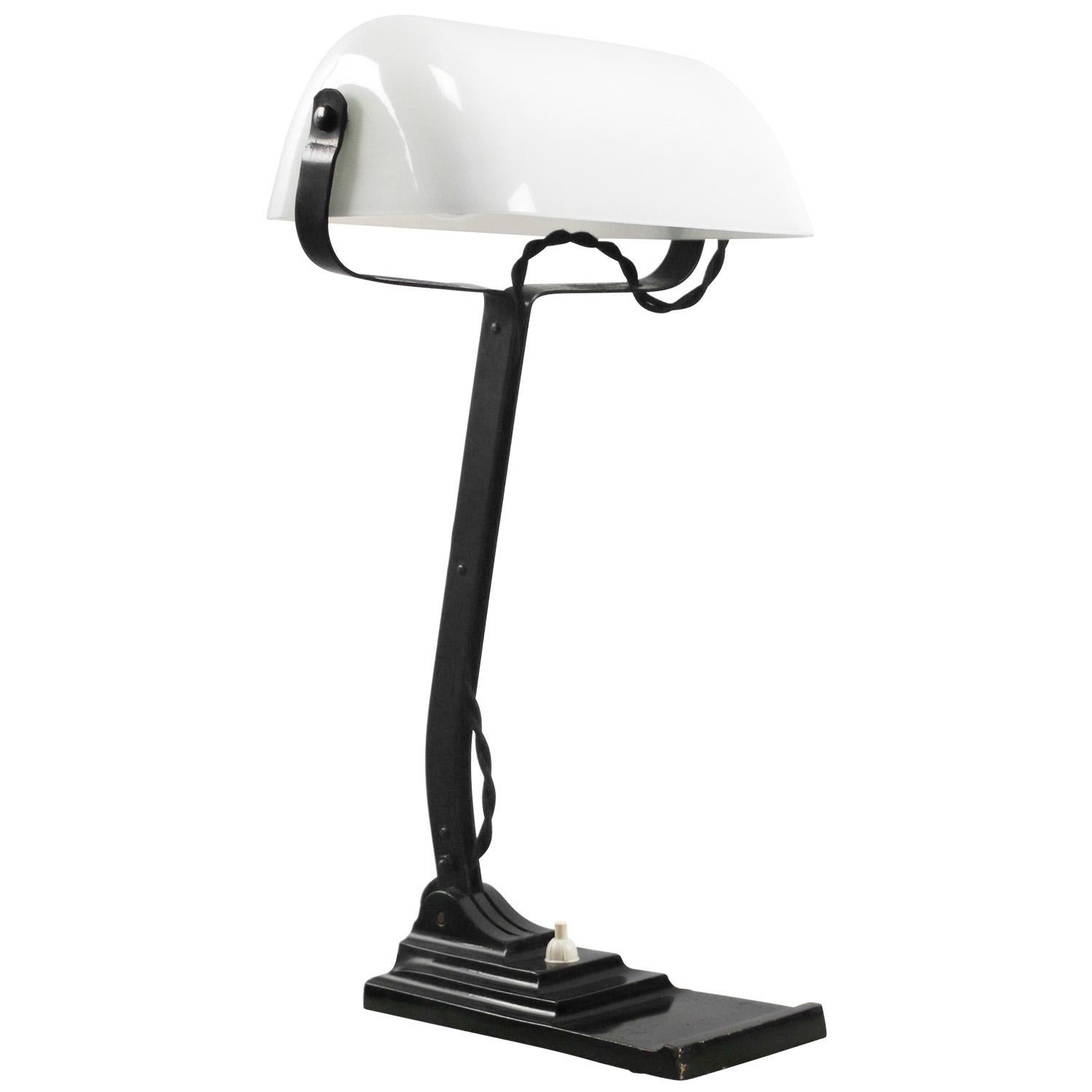 White opaline glass, cast iron desk light / banker’s lamp
2,5 meter black cotton flex, plug and switch in base

Also, available with US/UK plug

Weight: 2.40 kg / 5.3 lb

Priced per individual item. All lamps have been made suitable by international