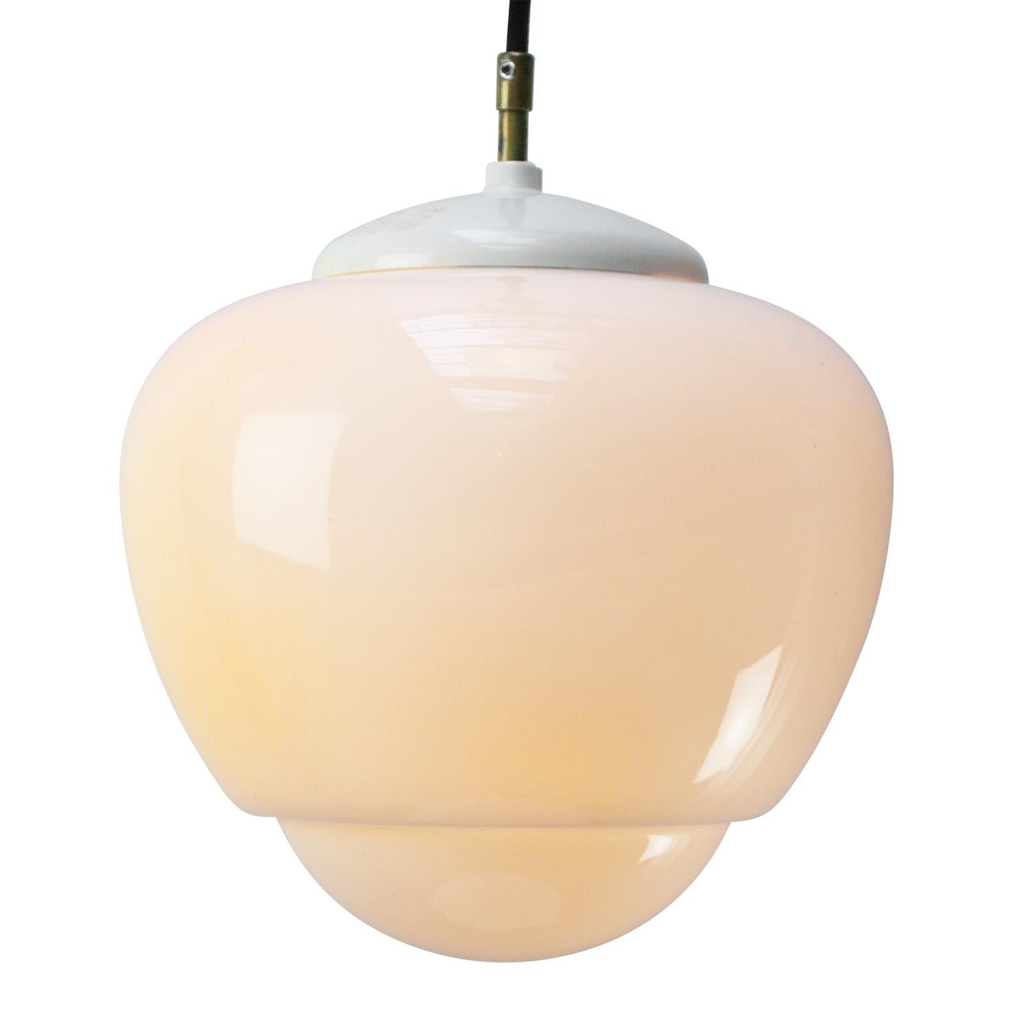 Opaline glass pendant.
White Bakelite and brass top
2 meter black wire

Weight: 2.00 kg / 4.4 lb

Priced per individual item. All lamps have been made suitable by international standards for incandescent light bulbs, energy-efficient and LED bulbs.