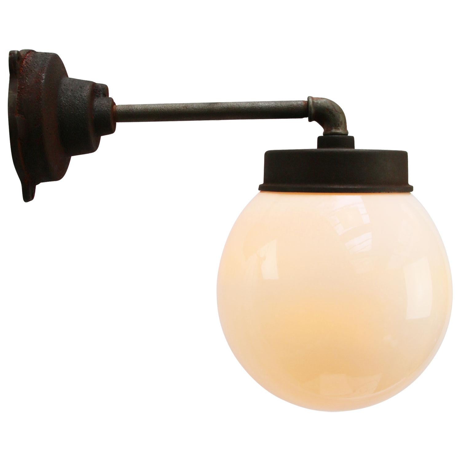 Opaline glass Industrial wall light.

Diameter cast iron wall piece: 12 cm. Three holes to secure.

Weight: 6.30 kg / 13.9 lb

All lamps have been made suitable by international standards for incandescent light bulbs, energy-efficient and LED