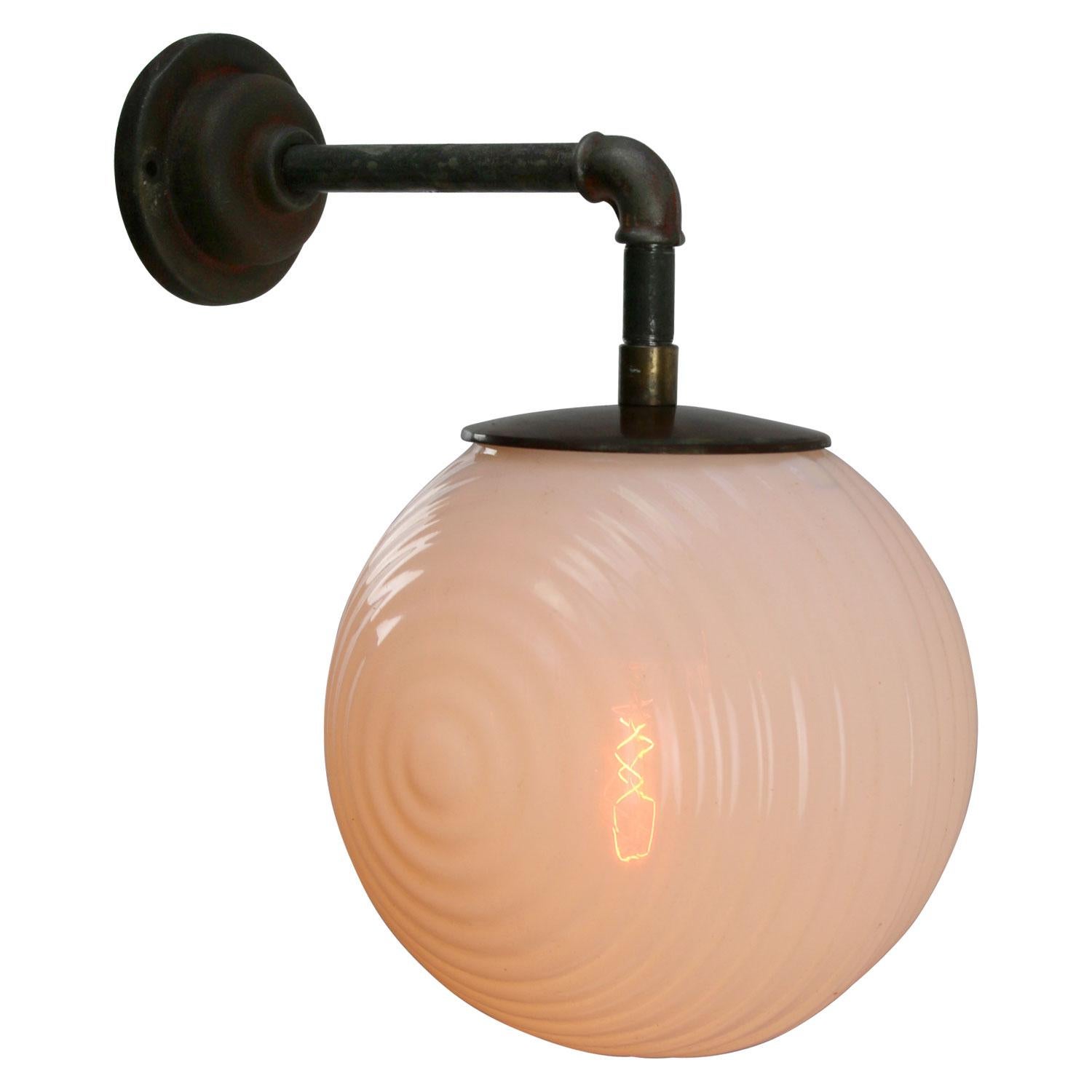 Opaline glass industrial wall light.
Brass top.

Diameter cast iron wall piece: 10.5 cm / 4”, 2 holes to secure

Weight: 4.80 kg / 10.6 lb

Priced per individual item. All lamps have been made suitable by international standards for incandescent