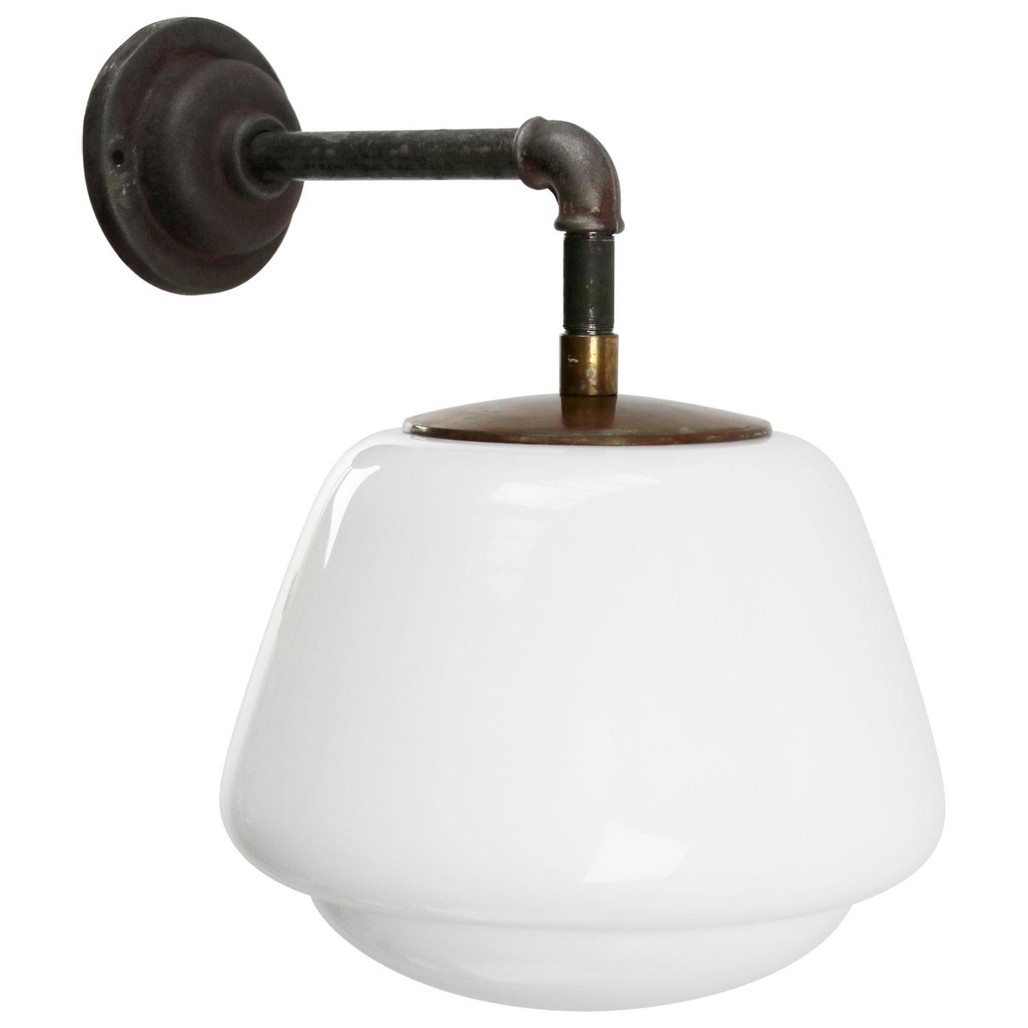 Opaline glass industrial wall light.
Brass top.

Measures: Diameter cast iron wall piece 10 cm. 2 holes to secure.

Weight: 4.80 kg / 10.6 lb

Priced per individual item. All lamps have been made suitable by international standards for incandescent