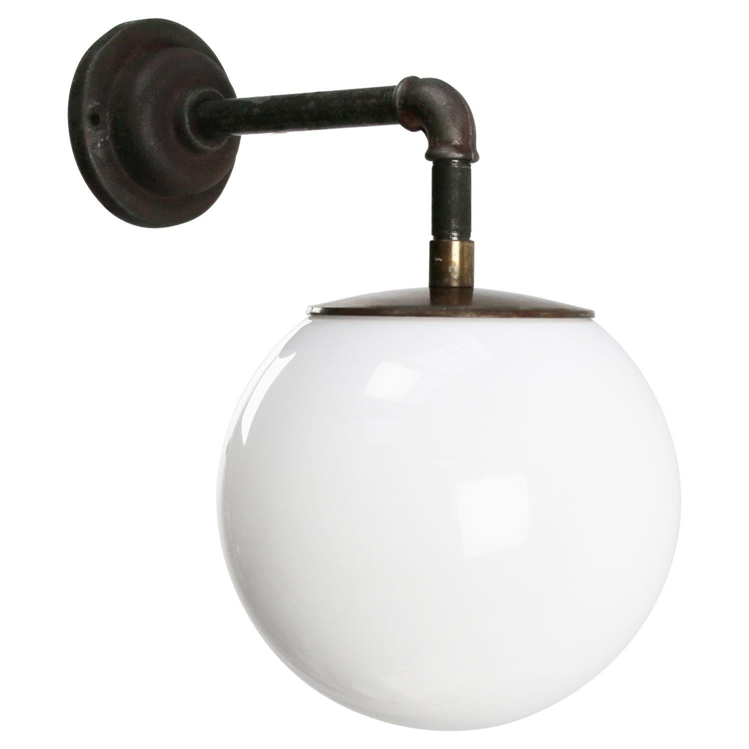 Opaline glass industrial wall light.
Brass top.

Measures: Diameter cast iron wall piece 10 cm. 2 holes to secure.

Weight: 4.80 kg / 10.6 lb

Priced per individual item. All lamps have been made suitable by international standards for