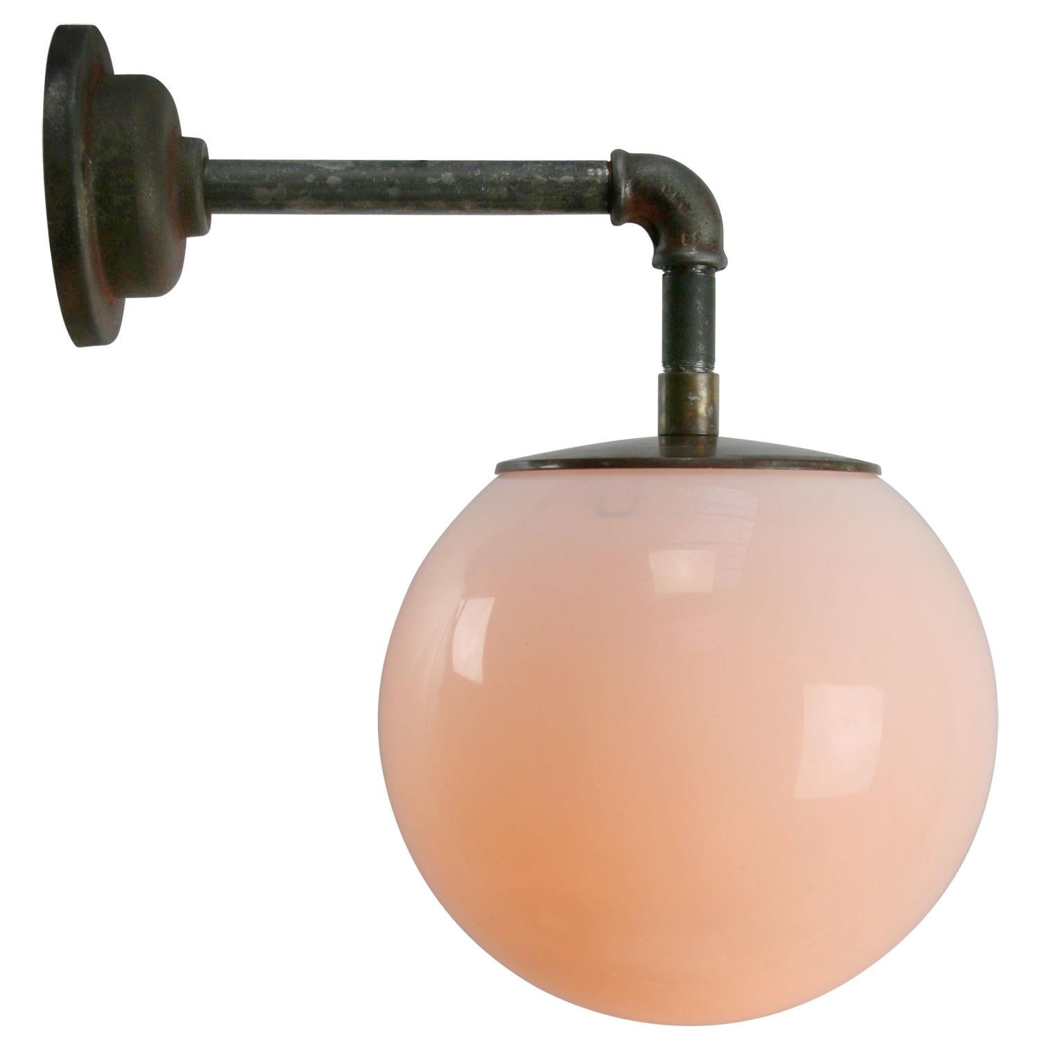 Opaline glass industrial wall light.
Brass top.

Measures: Diameter cast iron wall piece 10.5 cm / 4”, 2 holes to secure

Weight: 4.80 kg / 10.6 lb

Priced per individual item. All lamps have been made suitable by international standards for