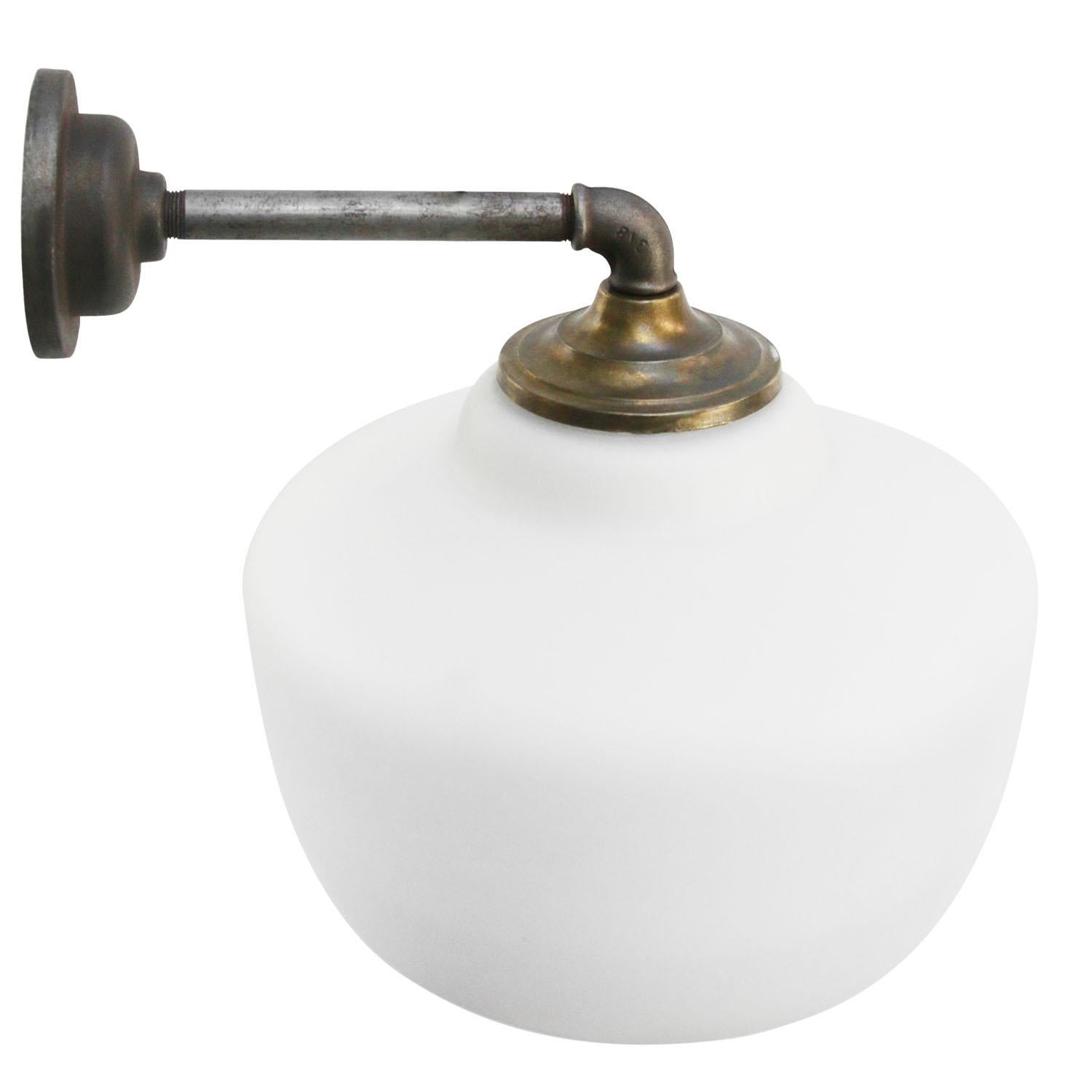 Opaline glass industrial wall light.
Brass top.

Diameter cast iron wall piece: 10.5 cm / 4”, 2 holes to secure

Weight: 2.80 kg / 6.2 lb

riced per individual item. All lamps have been made suitable by international standards for incandescent light