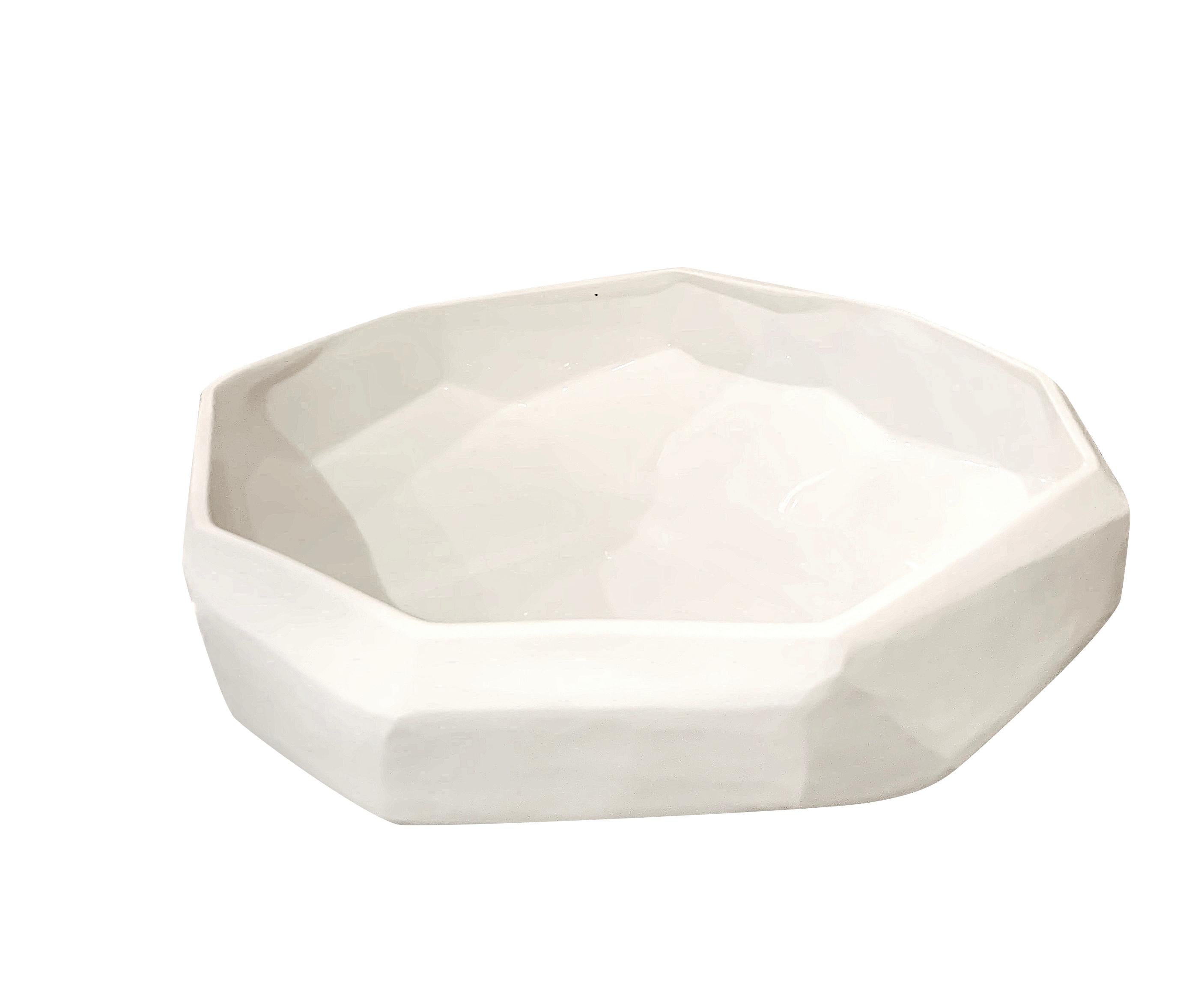 Romanian opaque white glass bowl with decorative cube shape.
The outside of the bowl is matte white, the interior is shiny.