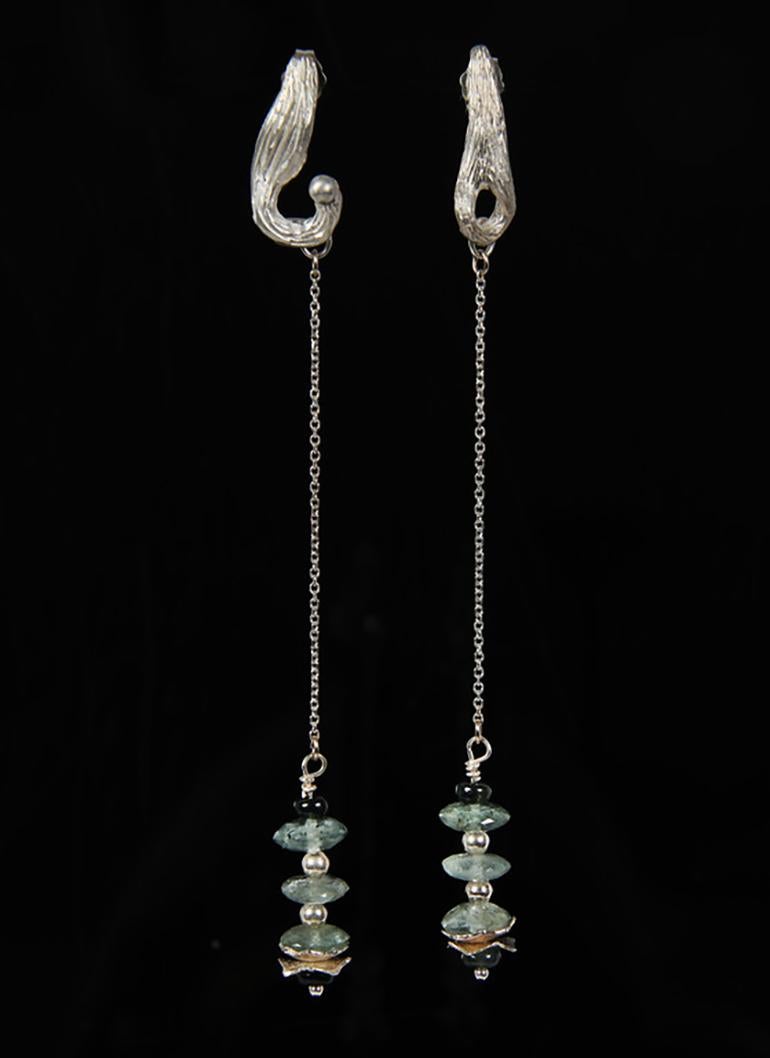 Hot! Hot! Hot! Chill with this moss aqua, green sapphire and silver earring.  