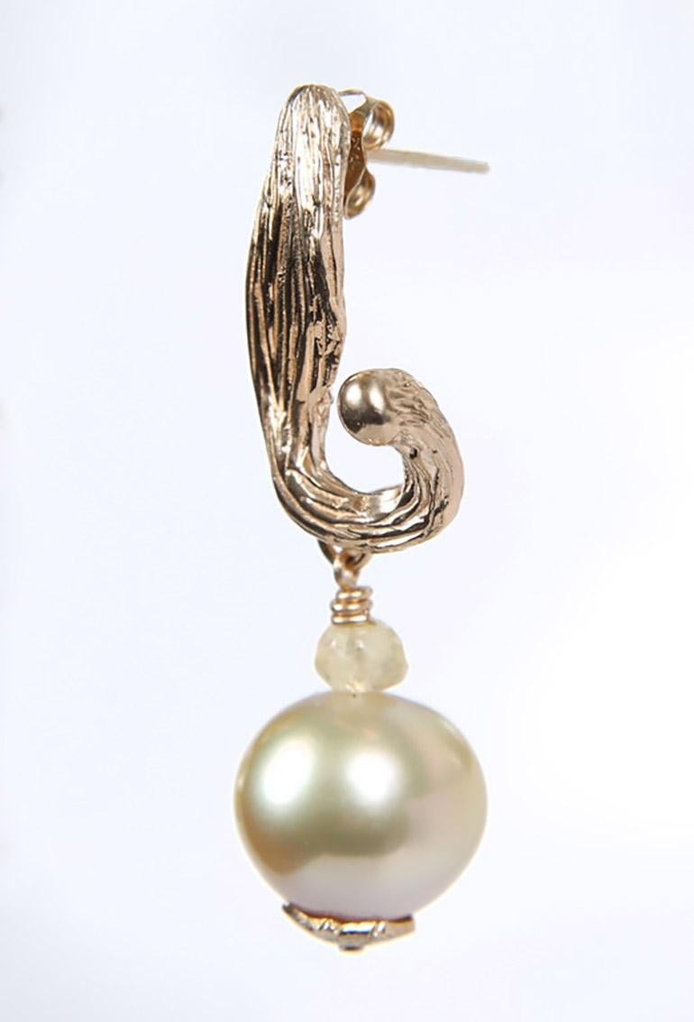 This south sea pearl, Songea sapphire, and gold earring hints at my bucket list.  One day I would love to visit an ice palace.  I could go to St. Petersburg (the oldest of the palaces), or Montreal or St. Paul.  I simply want to absorb the wonder of