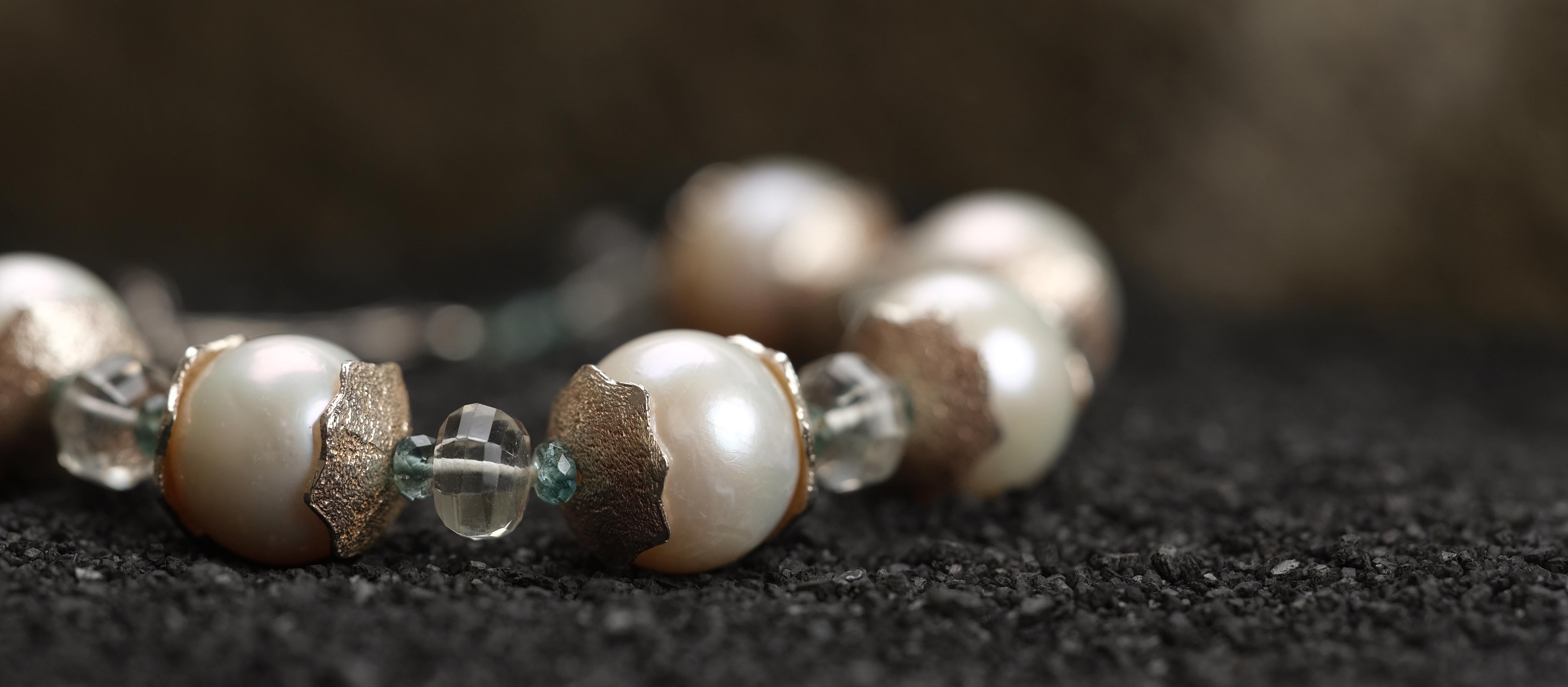 This pearl, prasiolite, apatite, and silver bracelet projects a soothing, yet thrilling vibe.  