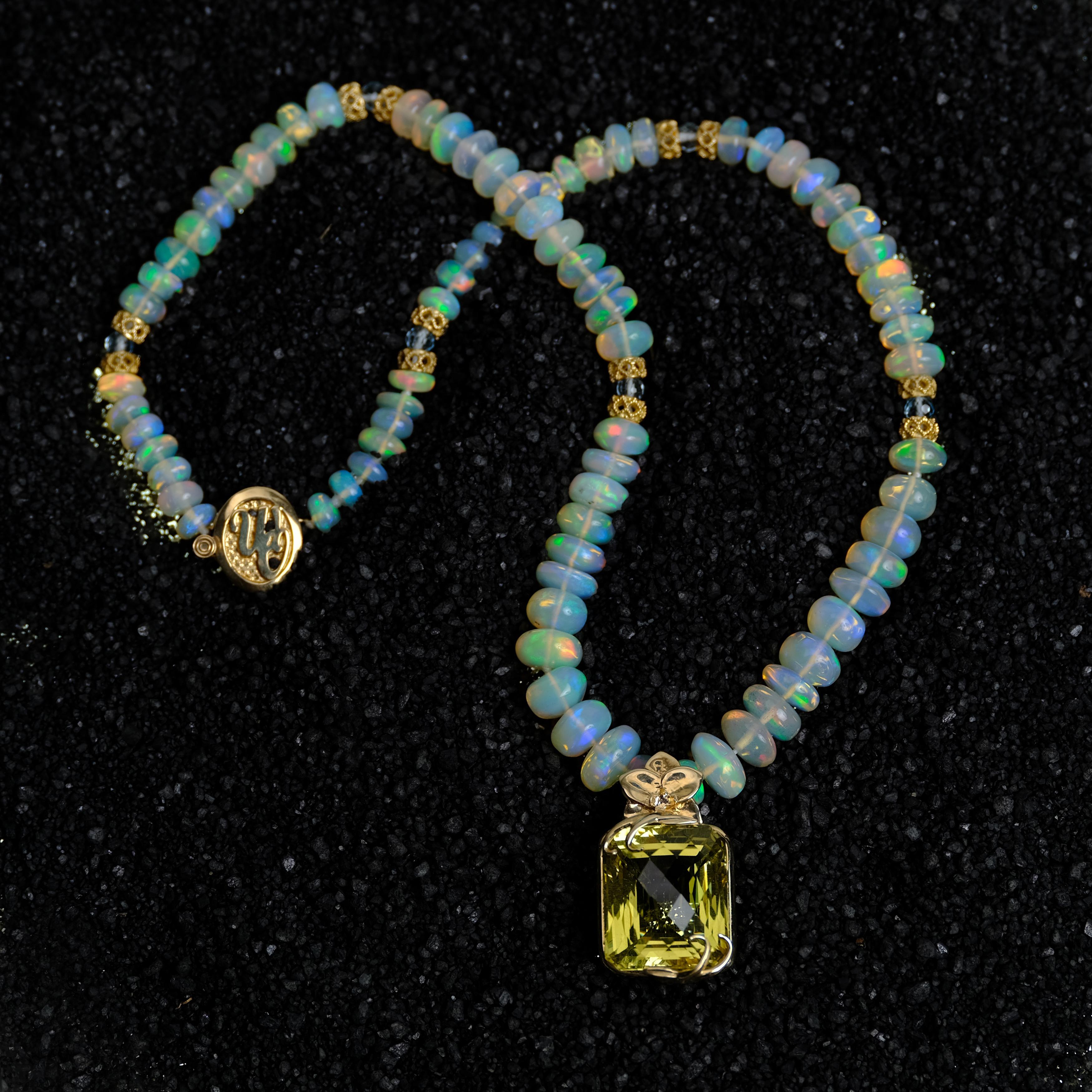 The ephemeral beauty of fireflies inspired this citrine, Welo opal, sky blue topaz, and gold pendant necklace.  

