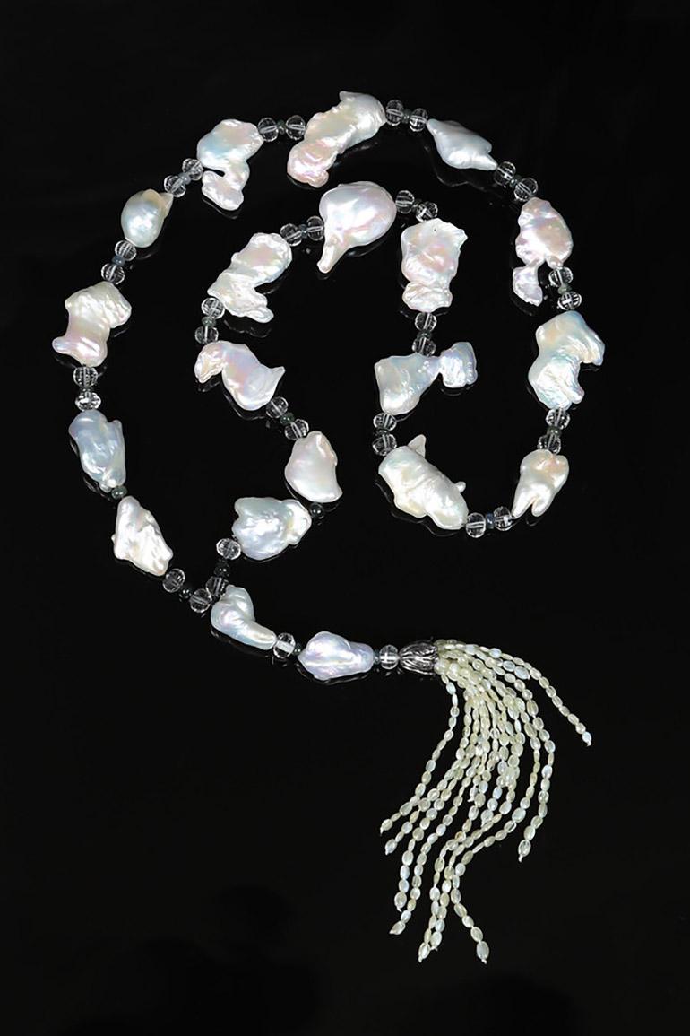 This pearl, prasiolite, sapphire, cat's eye chrysoberyl, and silver necklace-called a sautoir in French-continues a cherished tradition. Centuries ago sautoirs incorporated royal insignia into celebrations. Pearls were especially honored. Coco