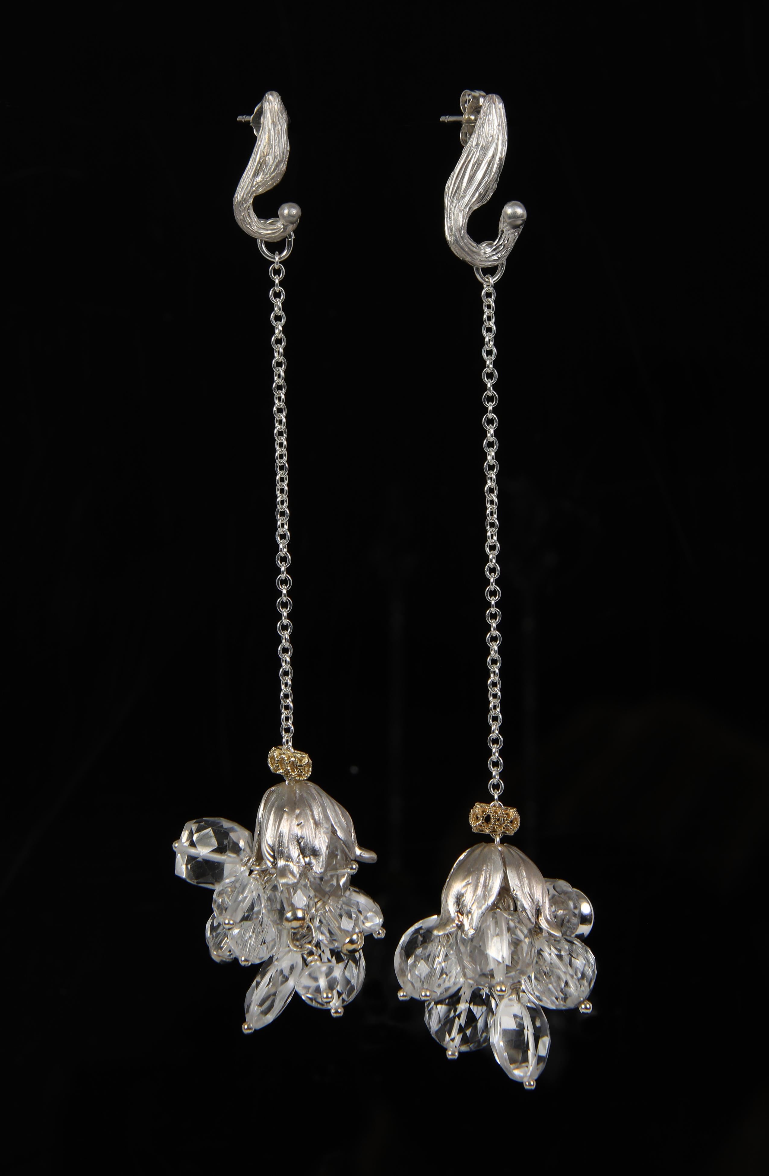 Let's dance to the rhythm of these clear quartz, gold, and silver earrings.  