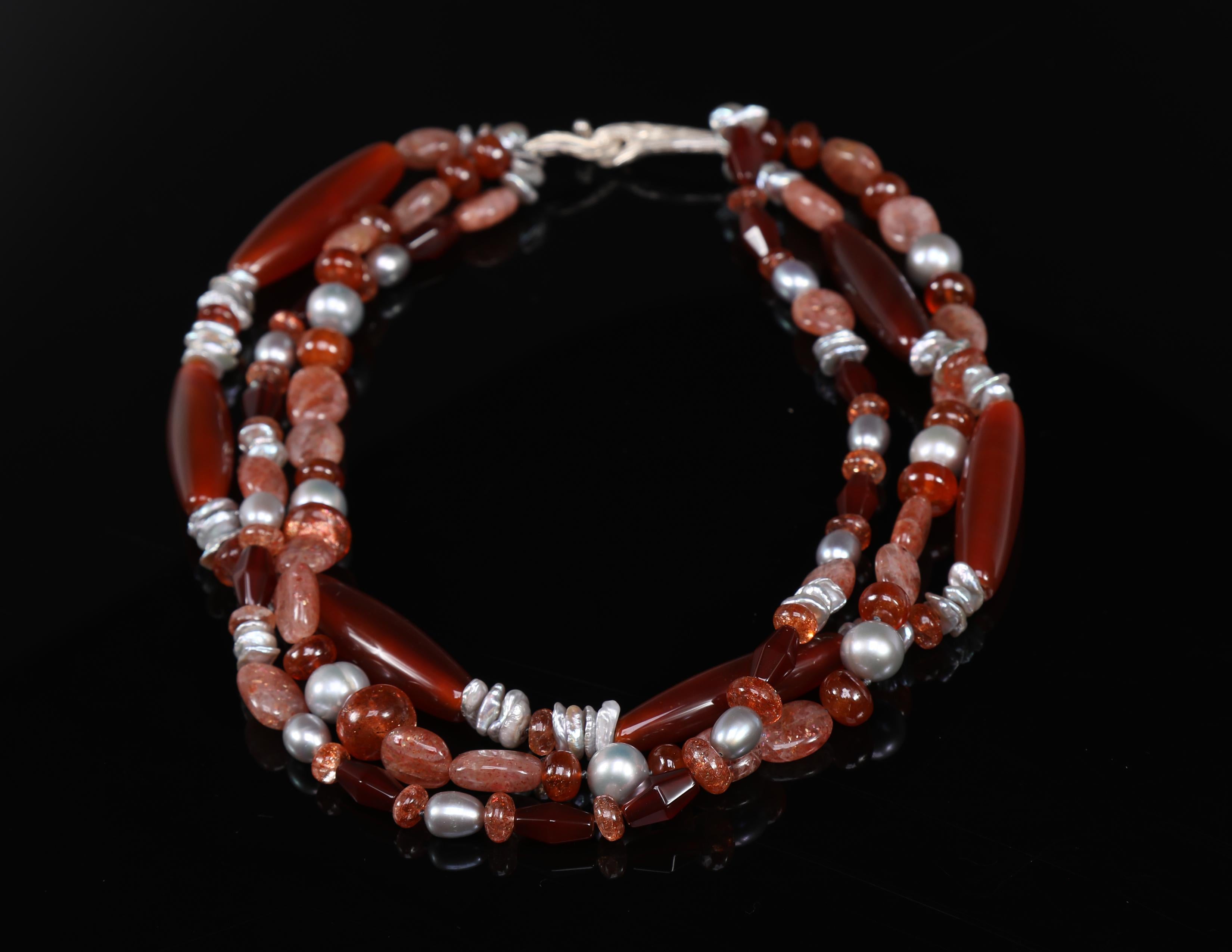 This multi-strand necklace of carnelian, sunstone, pearl, and silver brings to mind a question raised by a wonderful customer.  