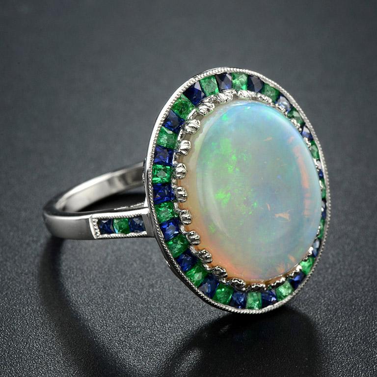 Art Deco White Oval Cabochon Opal with Emerald & Sapphire Fancy Halo Set White Gold Ring For Sale