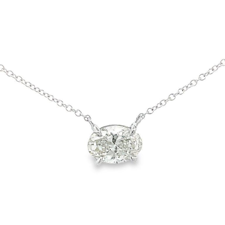 Introducing our beautiful solitaire white oval diamond pendant, it features a total of 1.04-carat weight. This diamond is sitting in a four-prong design that is made in 14-carat white gold with a delicate and stylish cable chain necklace. This