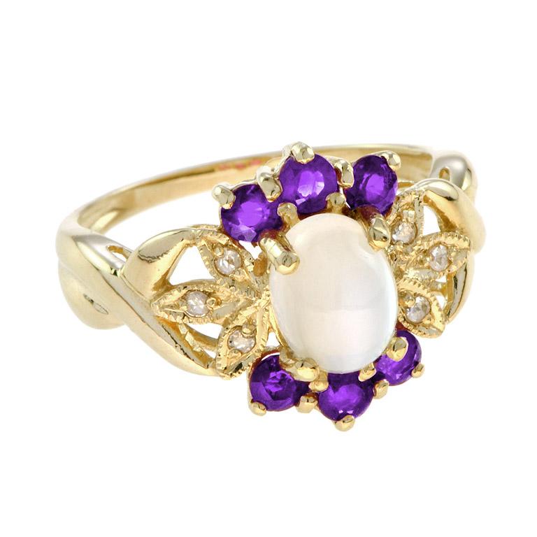 One of the most unique rings we’ve ever made! This moonstone ring features a 1.5-carat oval cabochon moonstone with amethyst and rose-cut diamonds. 14K Yellow Gold. 
Ring Information
Style: Vintage
Total weight: 4.20 g. (approx. total weight)
Center
