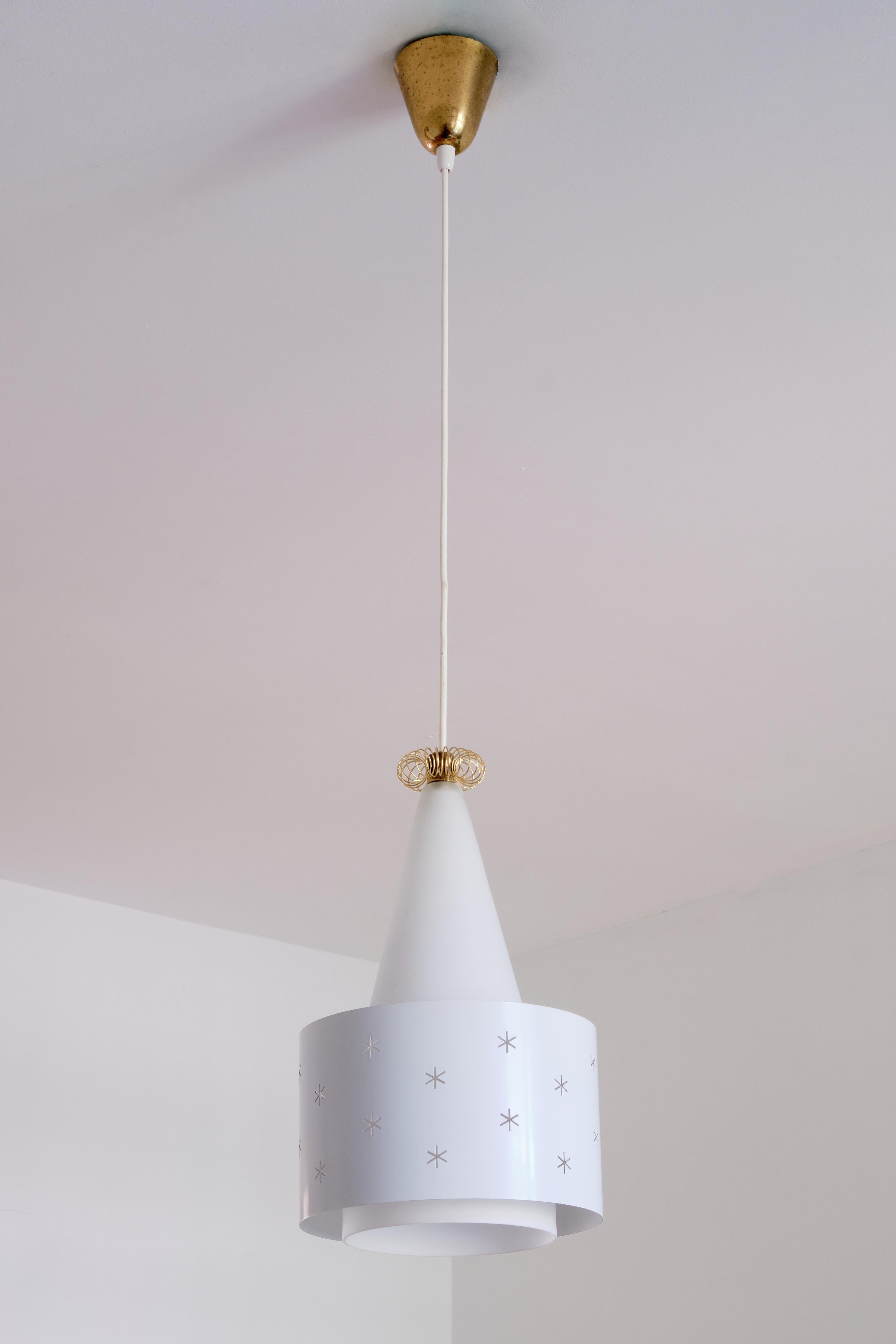 A rare white pendant designed by Paavo Tynell and produced by Idman in 1955. The model number is K2-10/ N-9241. The conical shade is made of a white matte opal glass, resulting in a soft and diffused light. The white painted metal ring appears to