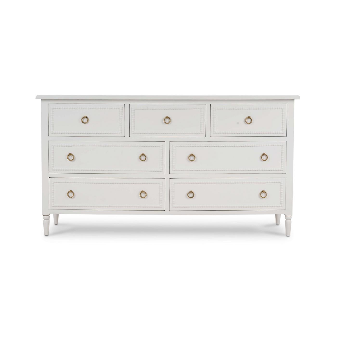 (A newly made reproduction) 

This beautifully crafted piece features a lightly distressed architectural white finish that complements any decor style. The delicate ring pulls add a hint of sophistication, making this chest a perfect addition to