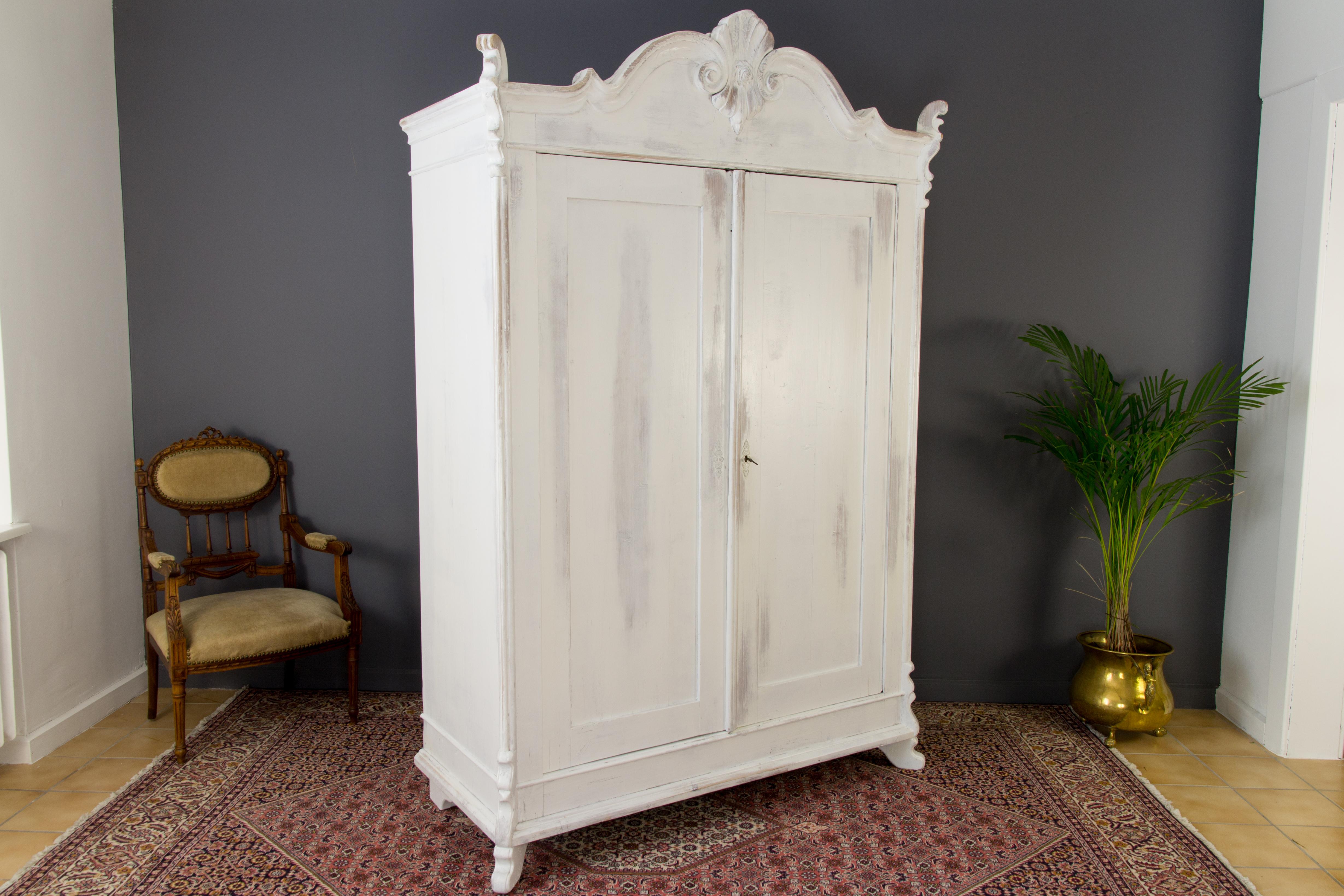 Latvian Baltic Pine White Painted Two-Door Armoire with Carved Crown, 1920's