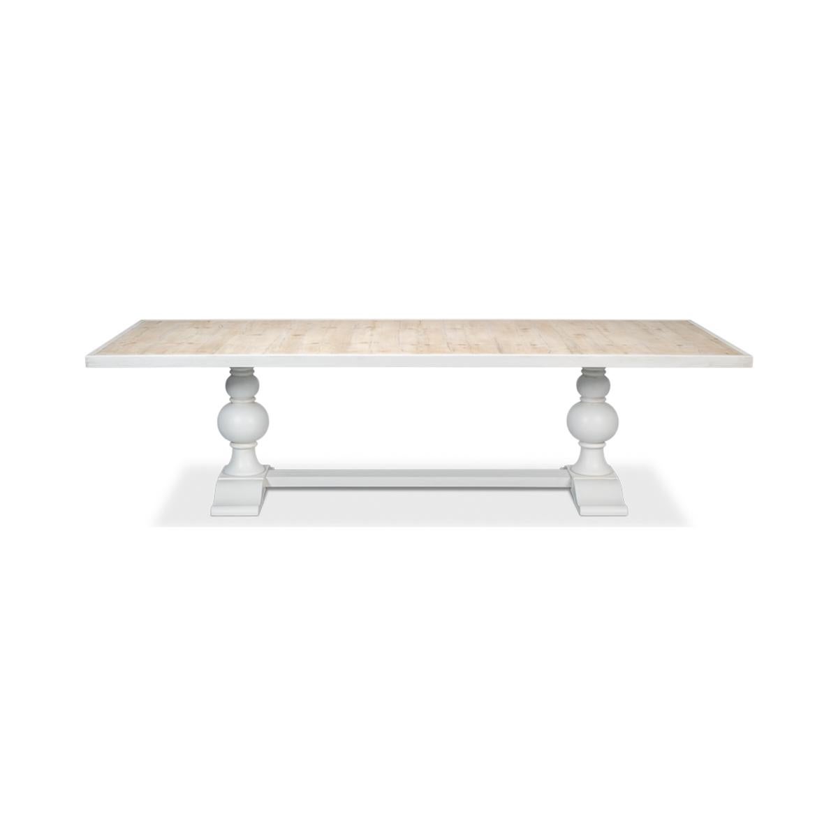 Wooden Dining Table. With an inlaid reclaimed wood top that adds finesse to your dining area. Supported by a turned baluster double pedestal base, this table marries classic charm with modern style. The white painted finish completes the look,