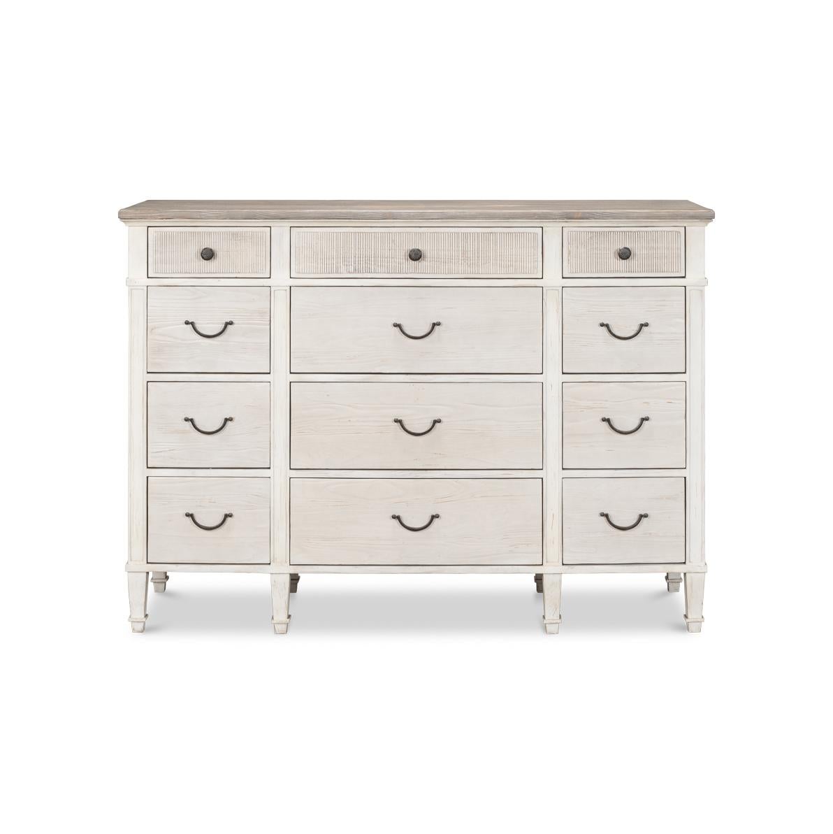 This dresser is meticulously crafted to embody the essence of a seaside retreat with its light, weathered finish and classic clean lines.

With 12 graduated drawers and an abundance of storage that won't overwhelm your space. Made from beechwood, in