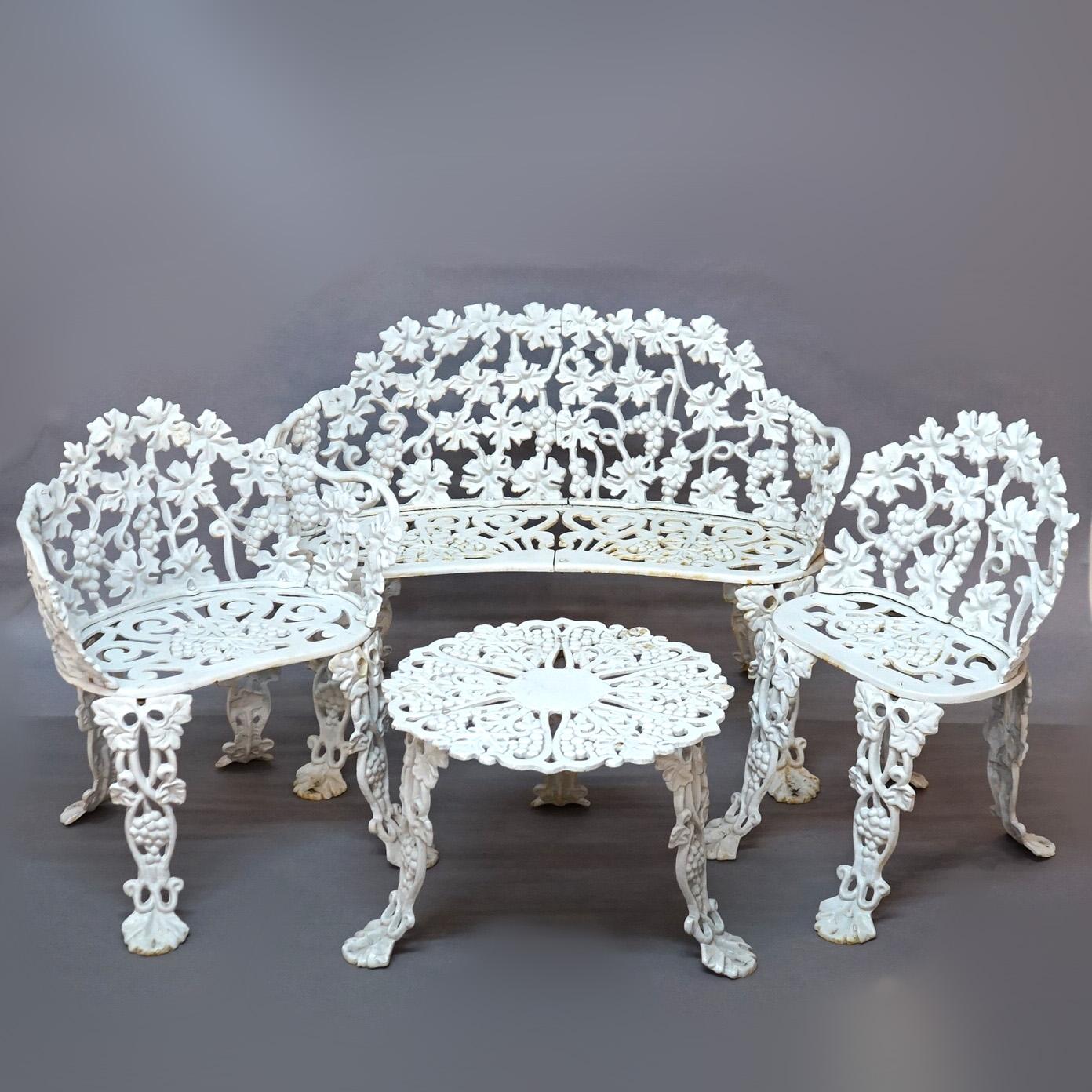 ***Ask About Reduced In-House Shipping Rates - Reliable Service & Fully Insured***
White Painted Cast Iron Grape & Leaf Four-Piece Garden Seating Set; Settee, Arm Chair, Side Chair and Center Table; 20thC

Measures- Small Table: 14.25''H x 23.5''W x