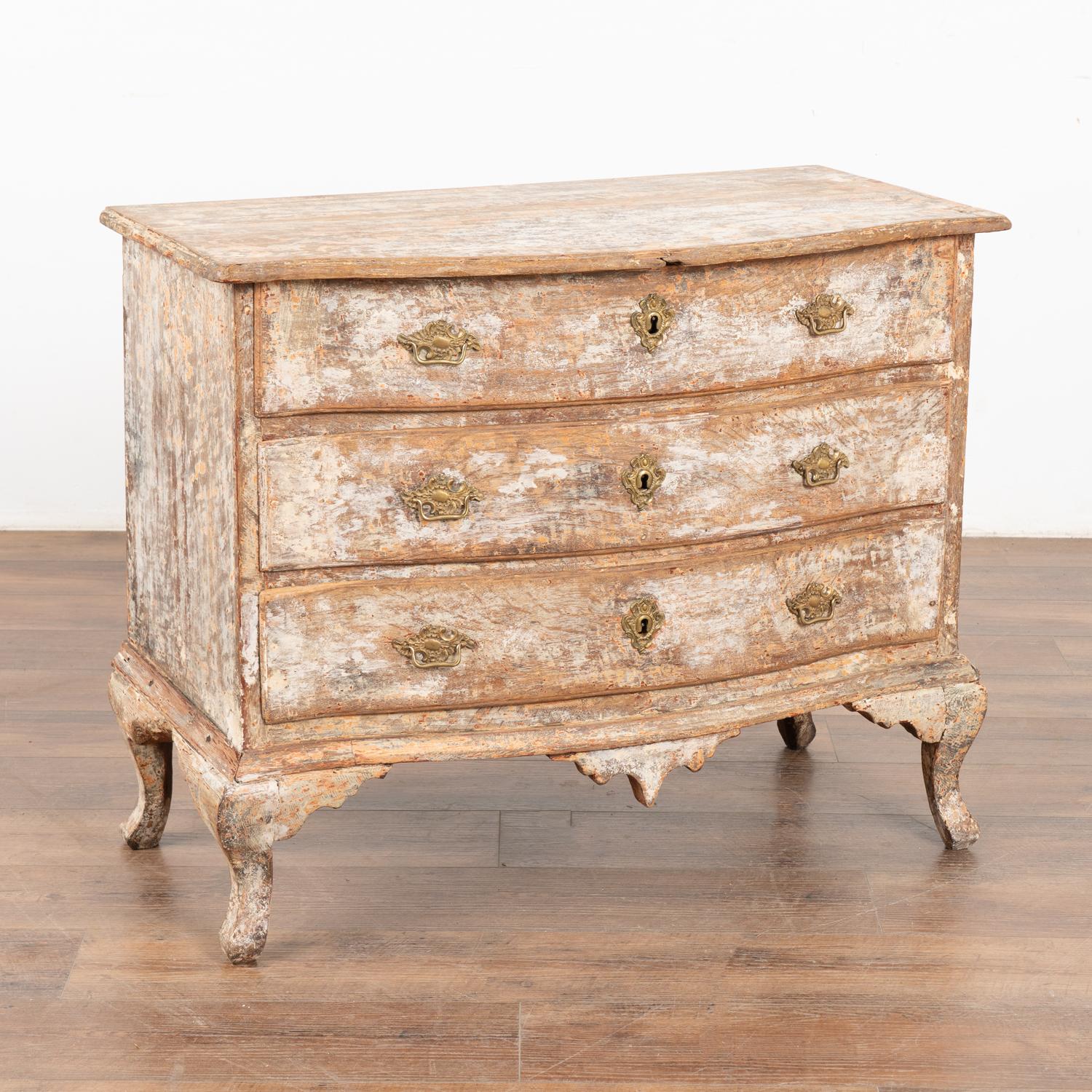The enticing curves of the drawers and cabriolet feet create the strong visual appeal in this pine chest of three drawers.
Restored, the white painted finish has been scraped throughout to fit the age and grace of this lovely dresser.
All scratches,