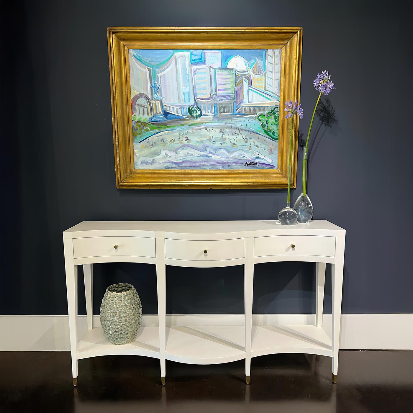 Finish in a hand-painted white linen color, this console table features a gracefully curved serpentine silhouette. With three spacious drawers and a lower shelf, it offers practical storage and display space for any room.

The tapered legs, accented