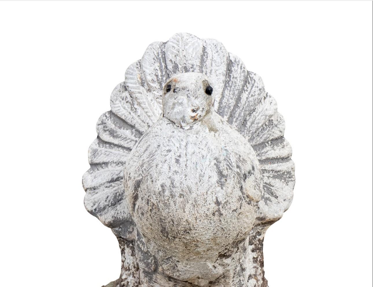 Mid 20th Century reconstituted stone garden ornament in the shape of a dove. Lovely detail on the robust tail feathers. Remnants of the original white paint. Please note of wear consistent with age. 6.5