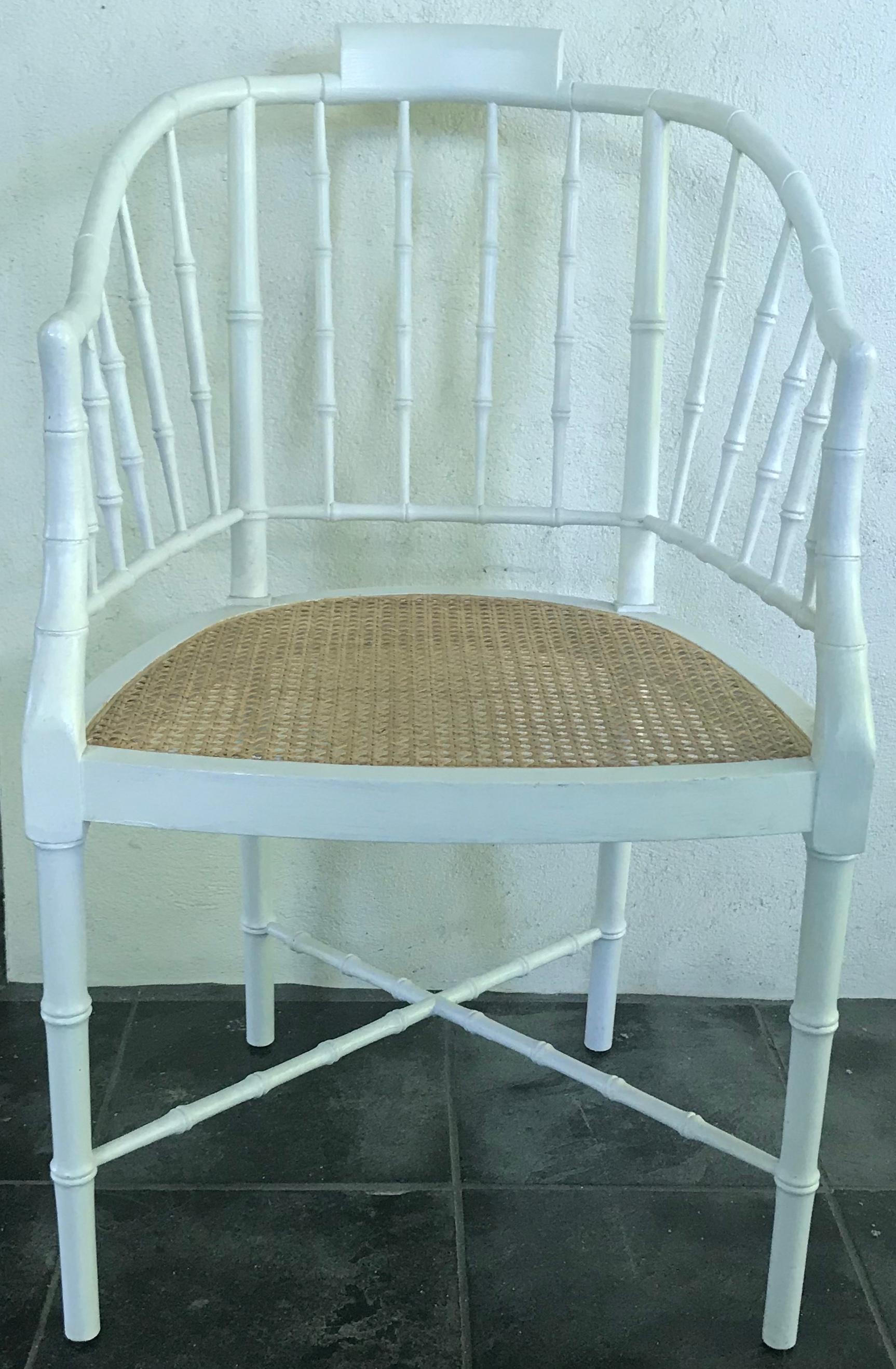 White painted faux bamboo armchair. Natural cane seat armchair/ desk chair in white painted faux bamboo perfect for the summer porch or in a guest room at a dressing table; with original faded blue velvet seat cushion with tassel ties. United