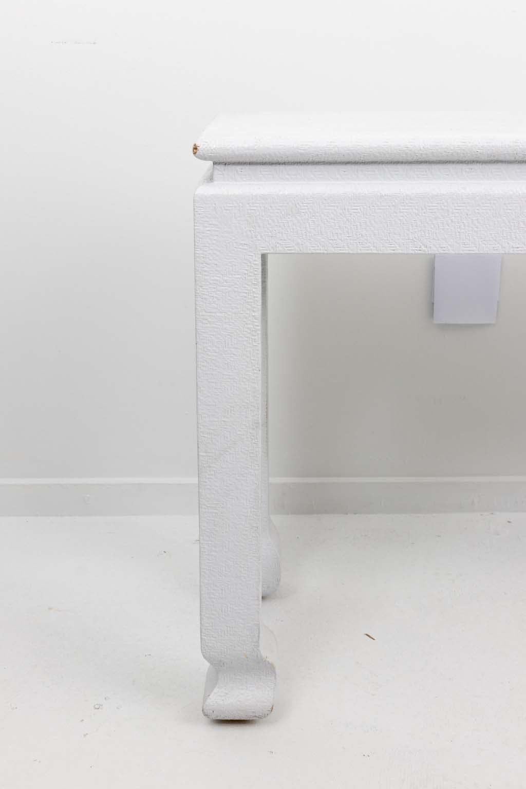 Mid 20th century white painted grasscloth wrapped console table in the manner of Karl Springer. 
