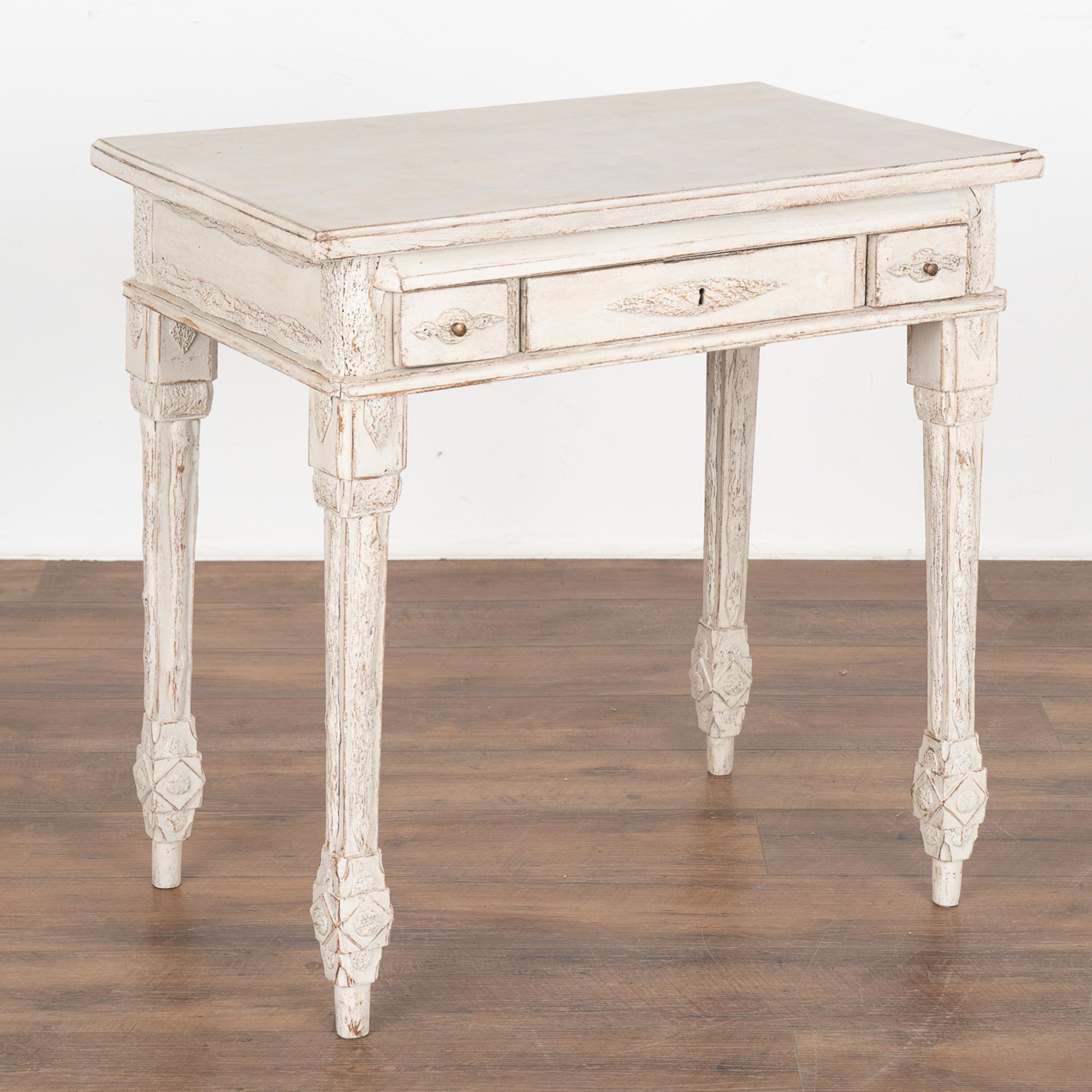 Swedish country pine side table with three drawers. The unique folk art embellishments on this small console table are faux wood. See the detailed photos to appreciate the areas that resemble wood bark along the legs, sides, and each drawer.
Drawers