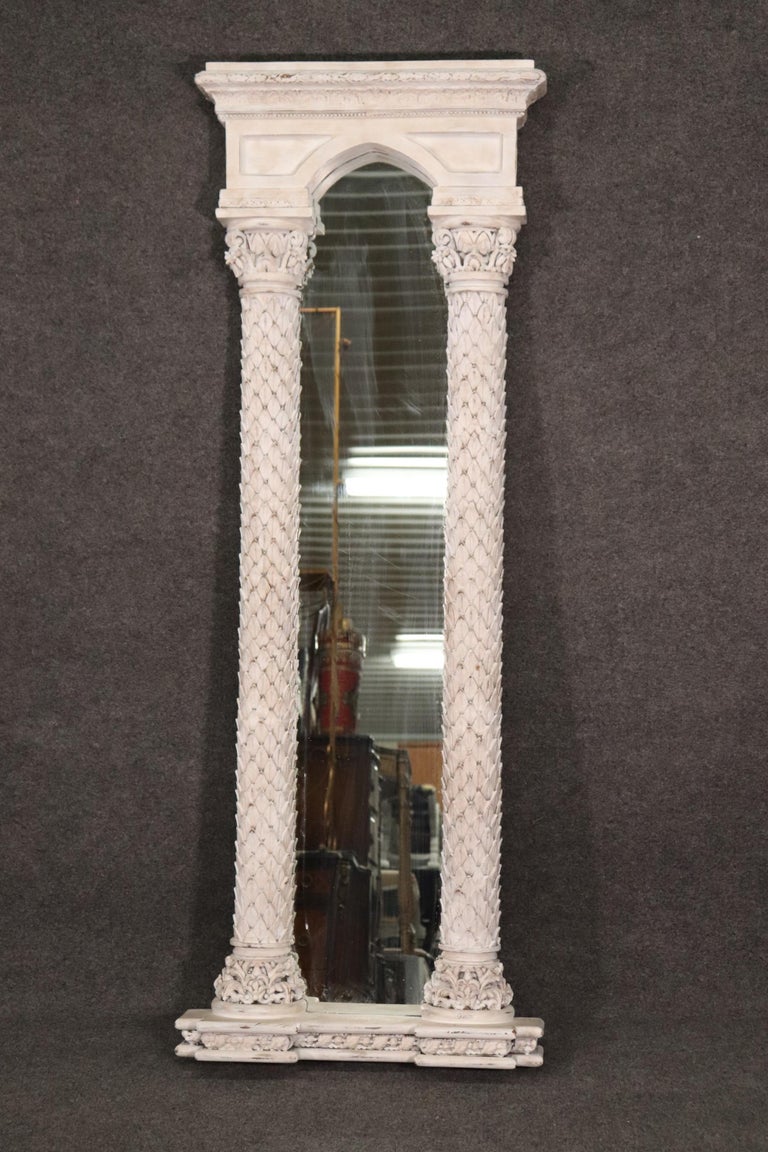 This is a unique mirror and I love it because its so dramatic and unique. The antique distressed white painted sirface will really pop on a dark blue or green wall. The mirror measures 71.5 tall x 26.5 wide x 7 inches deep. The mirror is great for a