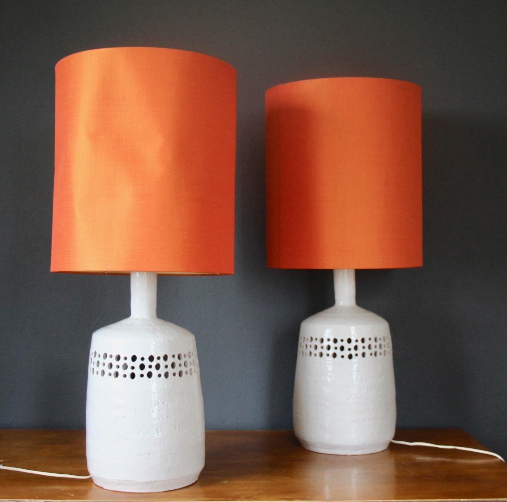 White pair of ceramic table lamp one of shade are used see photo.
