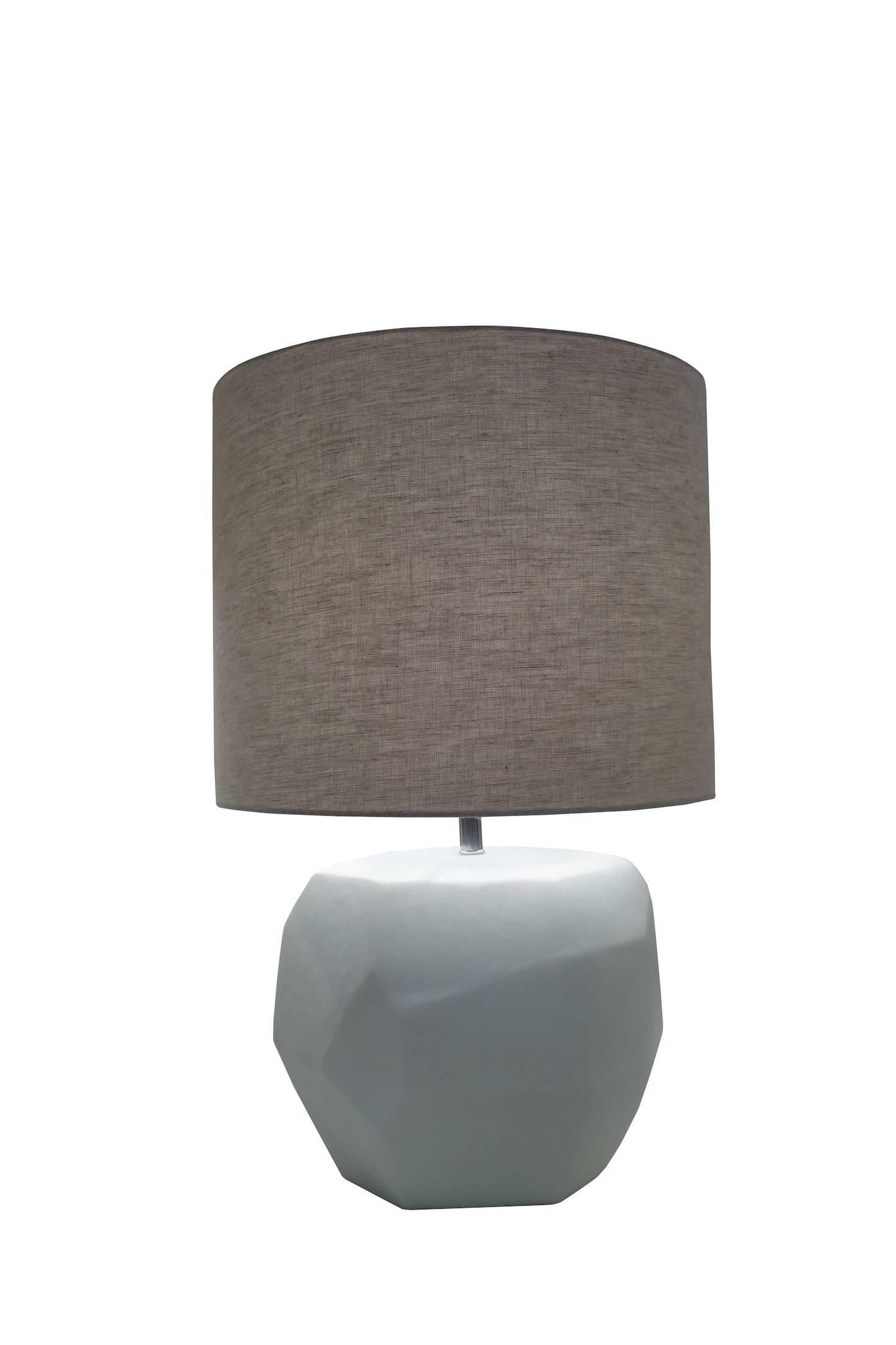 Contemporary Romanian matte white pair of lamps with cubist decorative shape.
Linen shade.
Newly wired.
Measures: Overall height with shade 25.5
