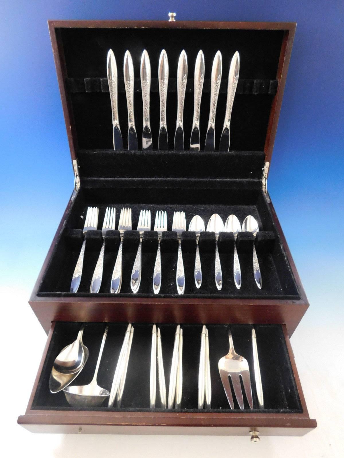 White Paisley by Gorham sterling silver Flatware set - 45 pieces. This pattern was introduced in the year 1966 and features a contemporary shaped handle that is partially engraved with flowing scrolls and floral detailing. This set includes:

Eight