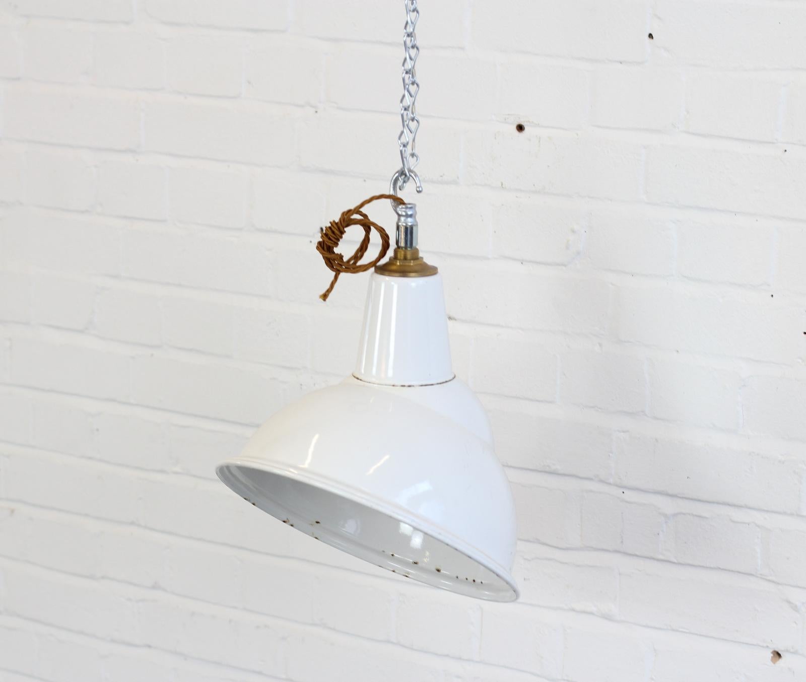 White Parabolic factory lights by Benjamin, circa 1950s

- Price is per light (13 available)
- Vitreous white enamel 
- Some shades still retain their original foil badges
- Comes with 100cm of gold twist cable
- Comes with 100cm of suspension