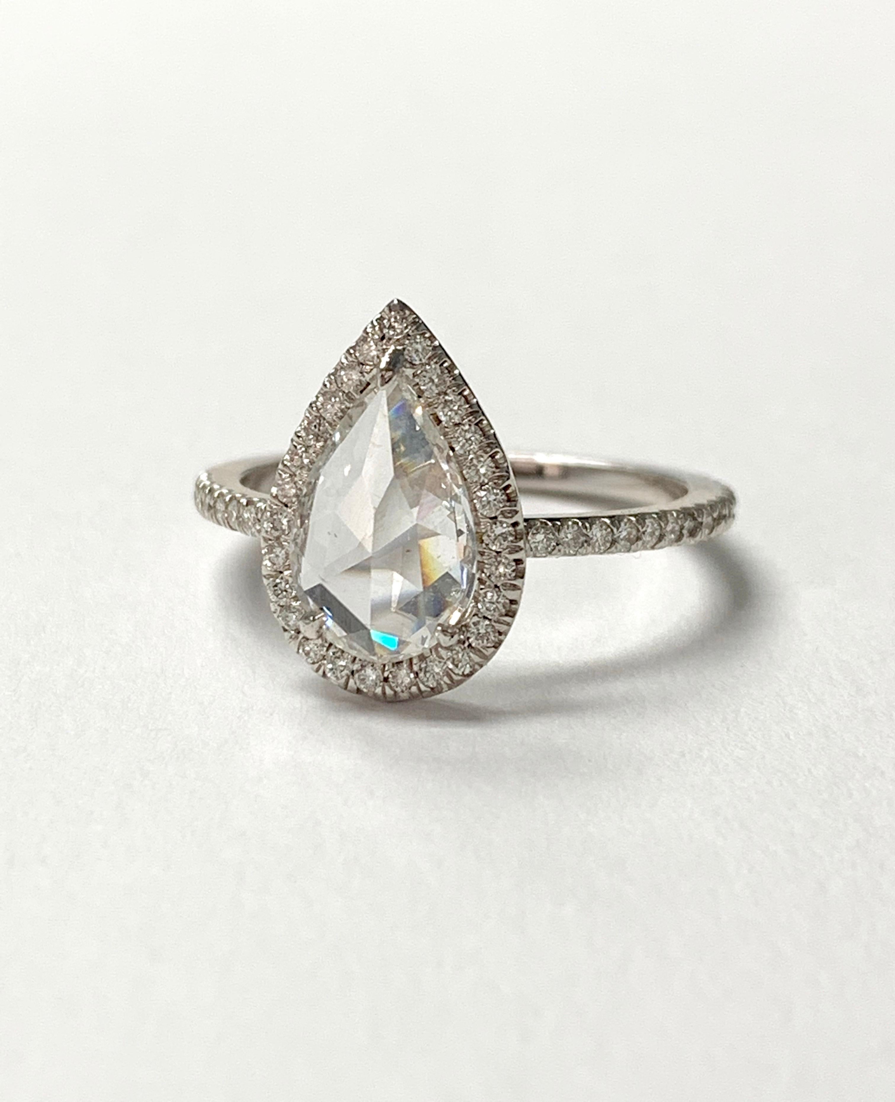 This gorgeous white pear shape rose cut diamond engagement ring is beautifully handmade in 18k white gold. 
The details are as follows : 
Pear shape rose cut diamond weight : 1.03 carat ( F color and SI1 clarity ) 
Diamond weight : 0.30 carat 
Metal