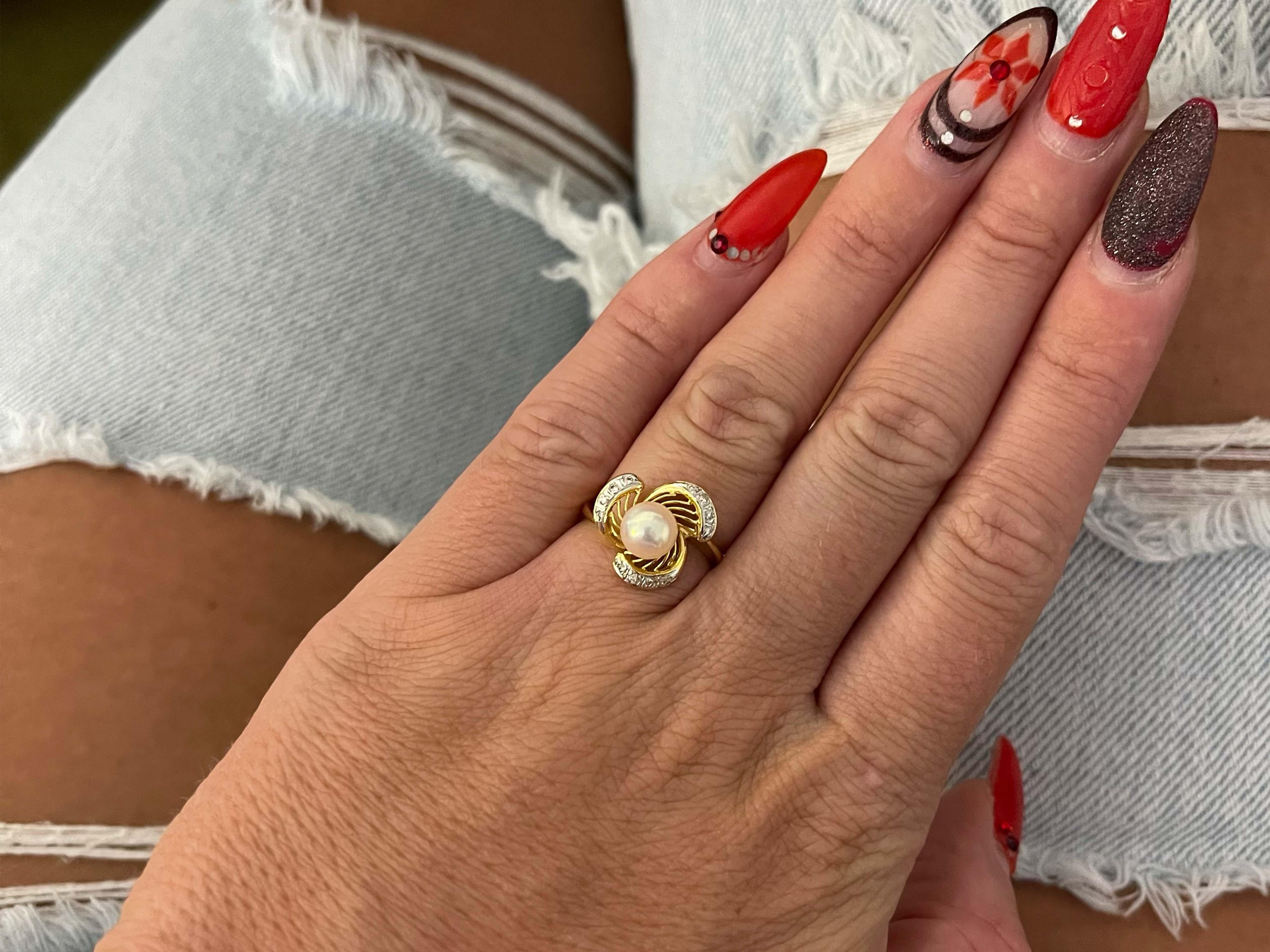Item Specifications:

Metal: 18K Yellow Gold

Style: Statement Ring

Ring Size: 5.75 (resizing available for a fee)

Total Weight: 3.7 Grams

Ring Height: 14 mm

Pearl Specifications:

Shape: Sphere

Diameter: 6.6 mm

Diamond Count: 12 round