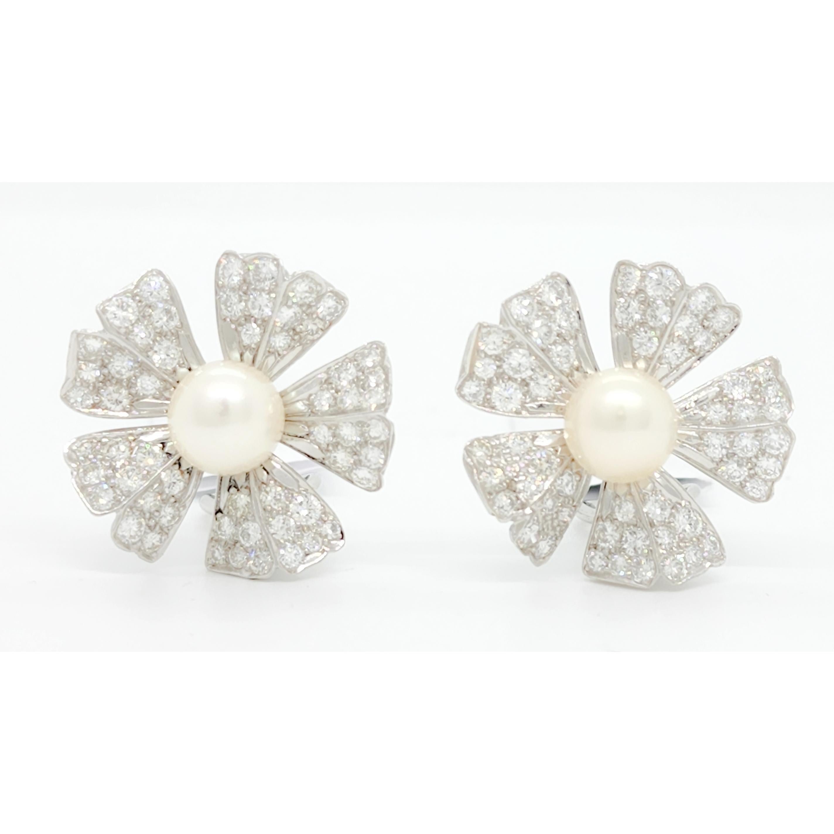 Beautiful white pearl round and diamond round earrings with omega backs.  Handmade with attention to detail.  Approximately 1.00 ct. of good quality, bright, and white diamonds.
